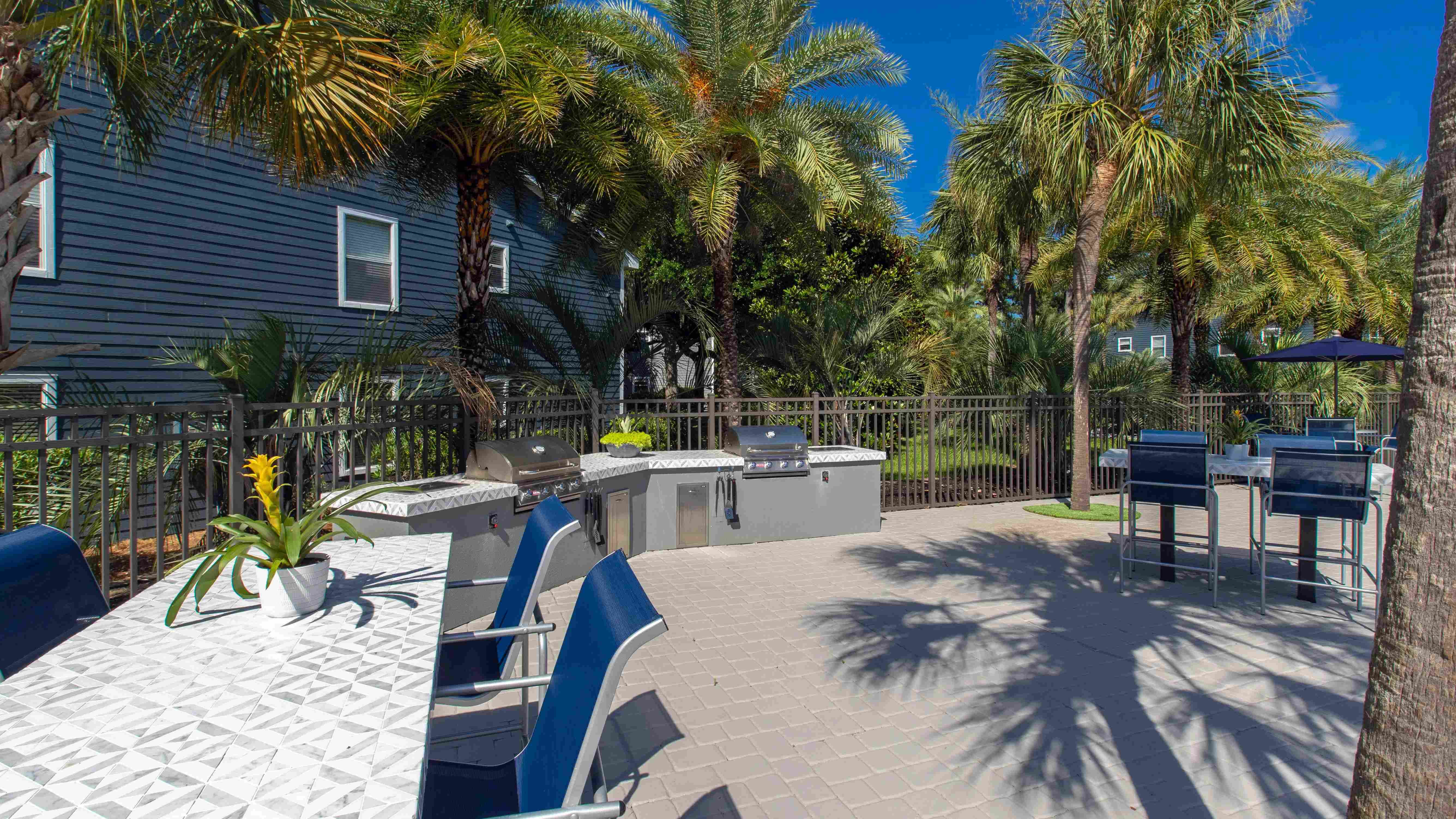 Our poolside outdoor kitchen is a perfect setting for shared meals under the sun.