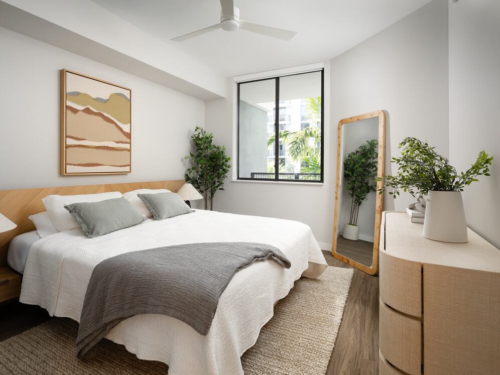 Primary bedroom with hard-surface vinyl plank flooring
