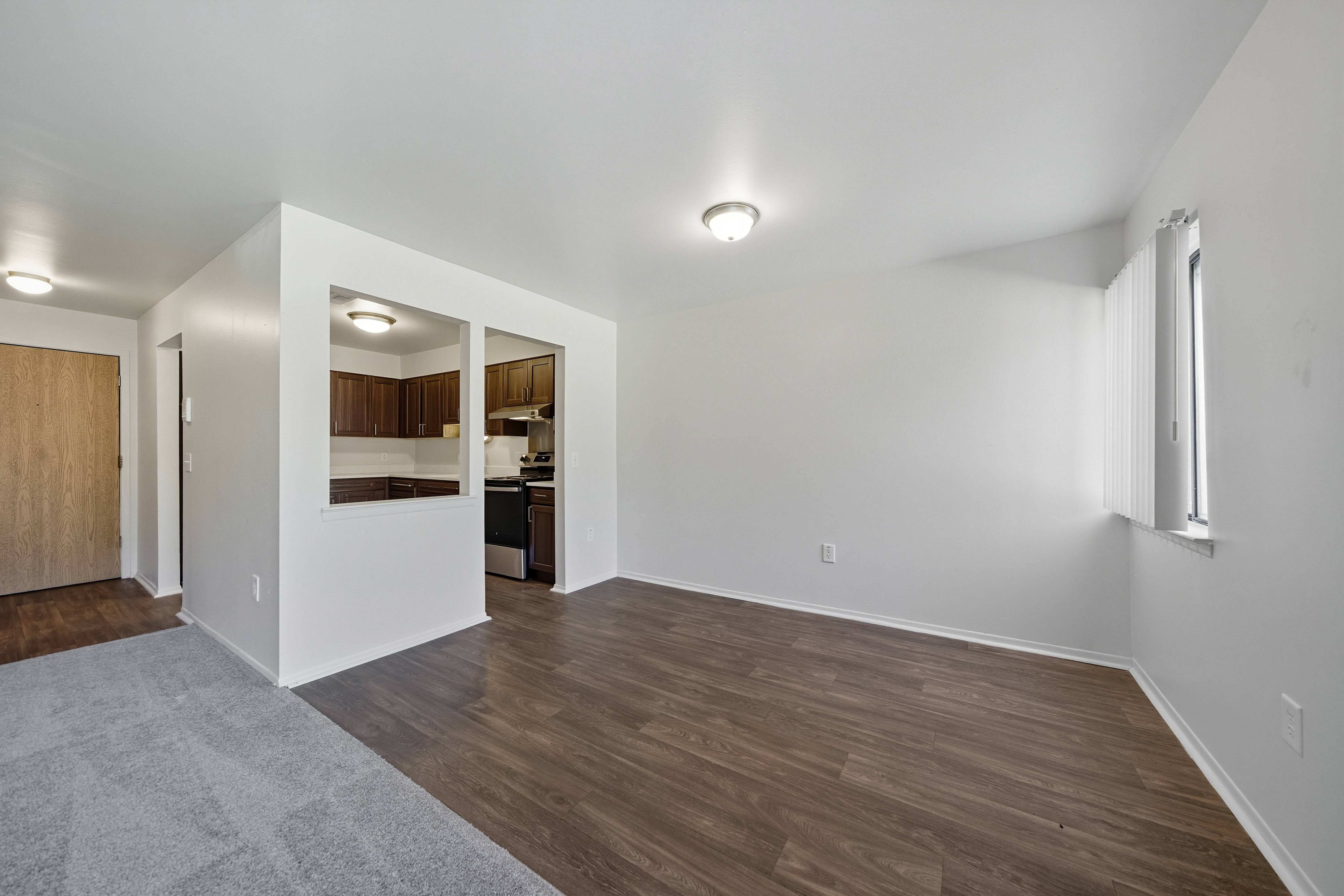 Open Living/Dining Room with natural light at Franklin River Apartments in Southfield, MIng Room with natural light at Franklin River Apartments in Southfield, MI