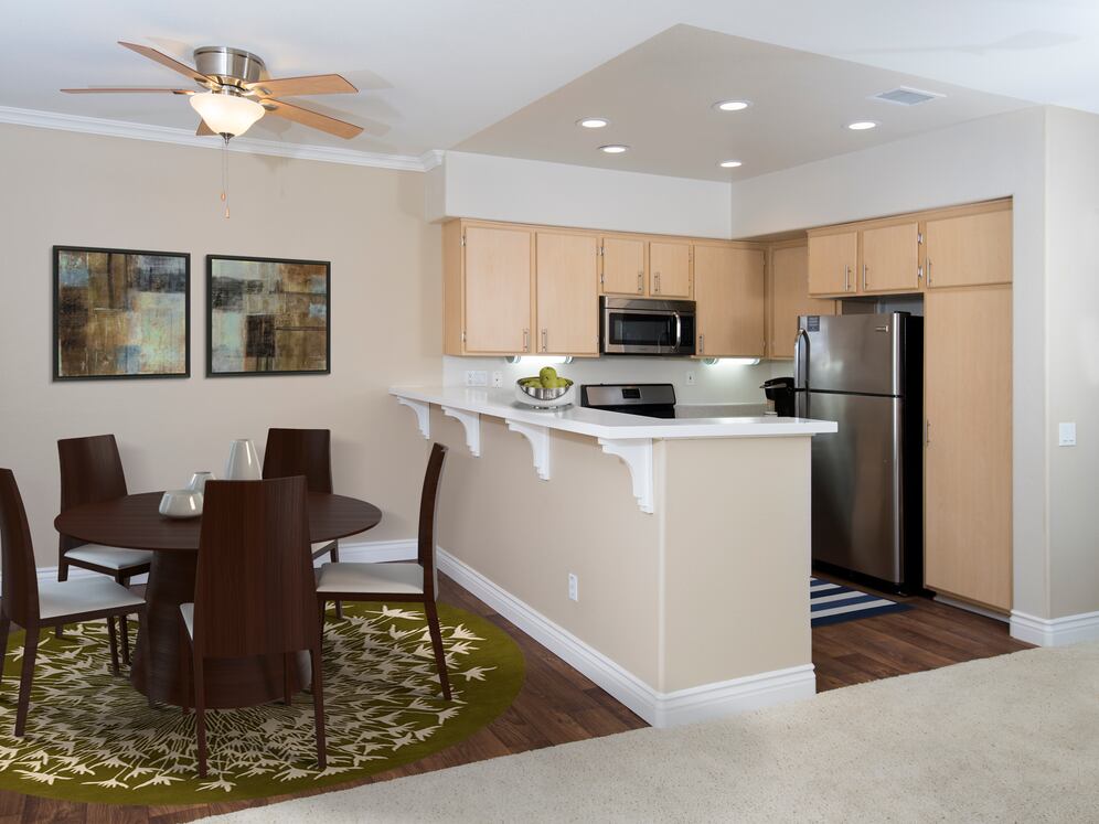 Kitchen and dining room with hard surface flooring