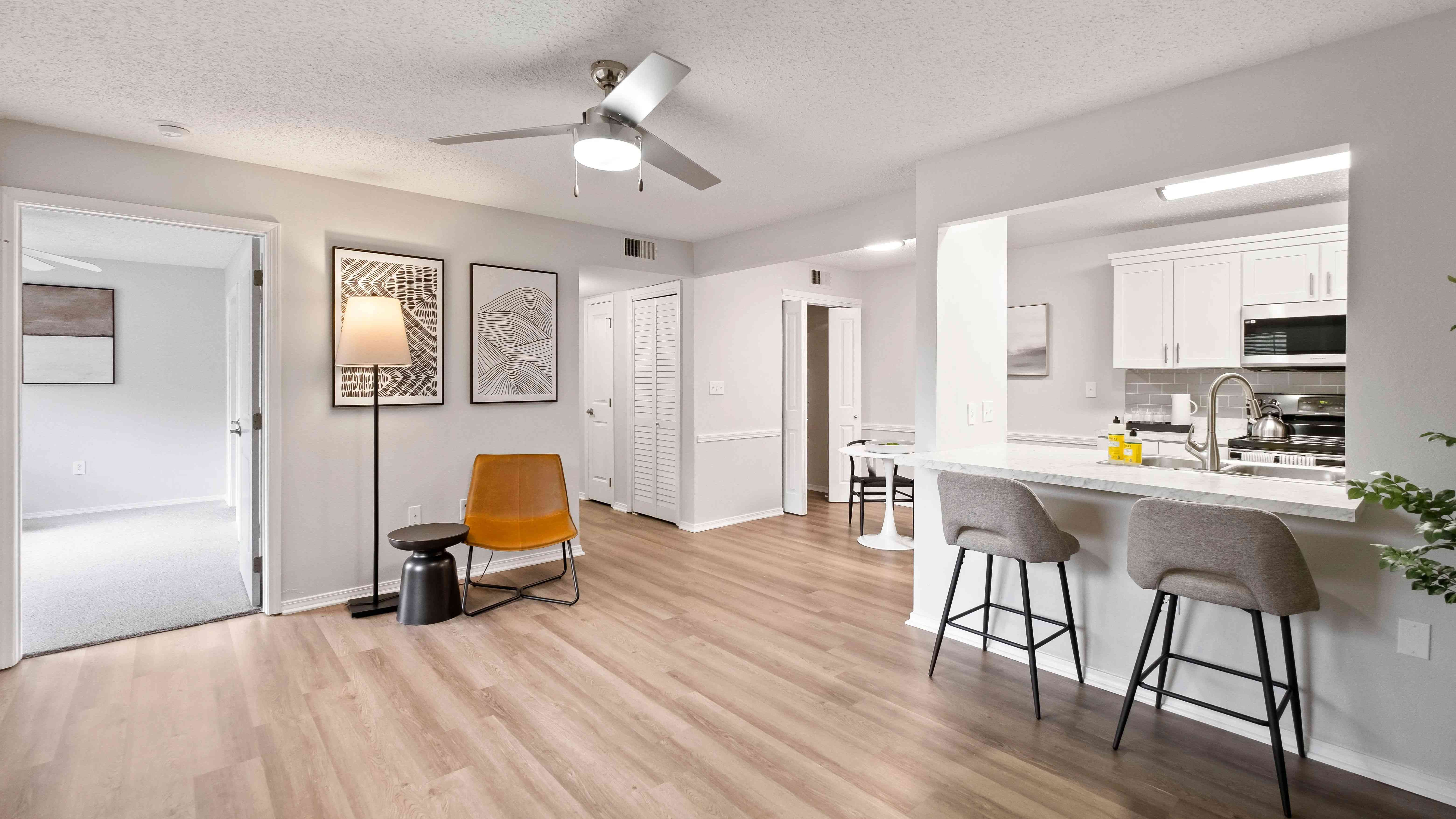 Indulge in the luxury of spacious living with generously proportioned open-concept living rooms with seamless wood-style flooring at The Avenue.
