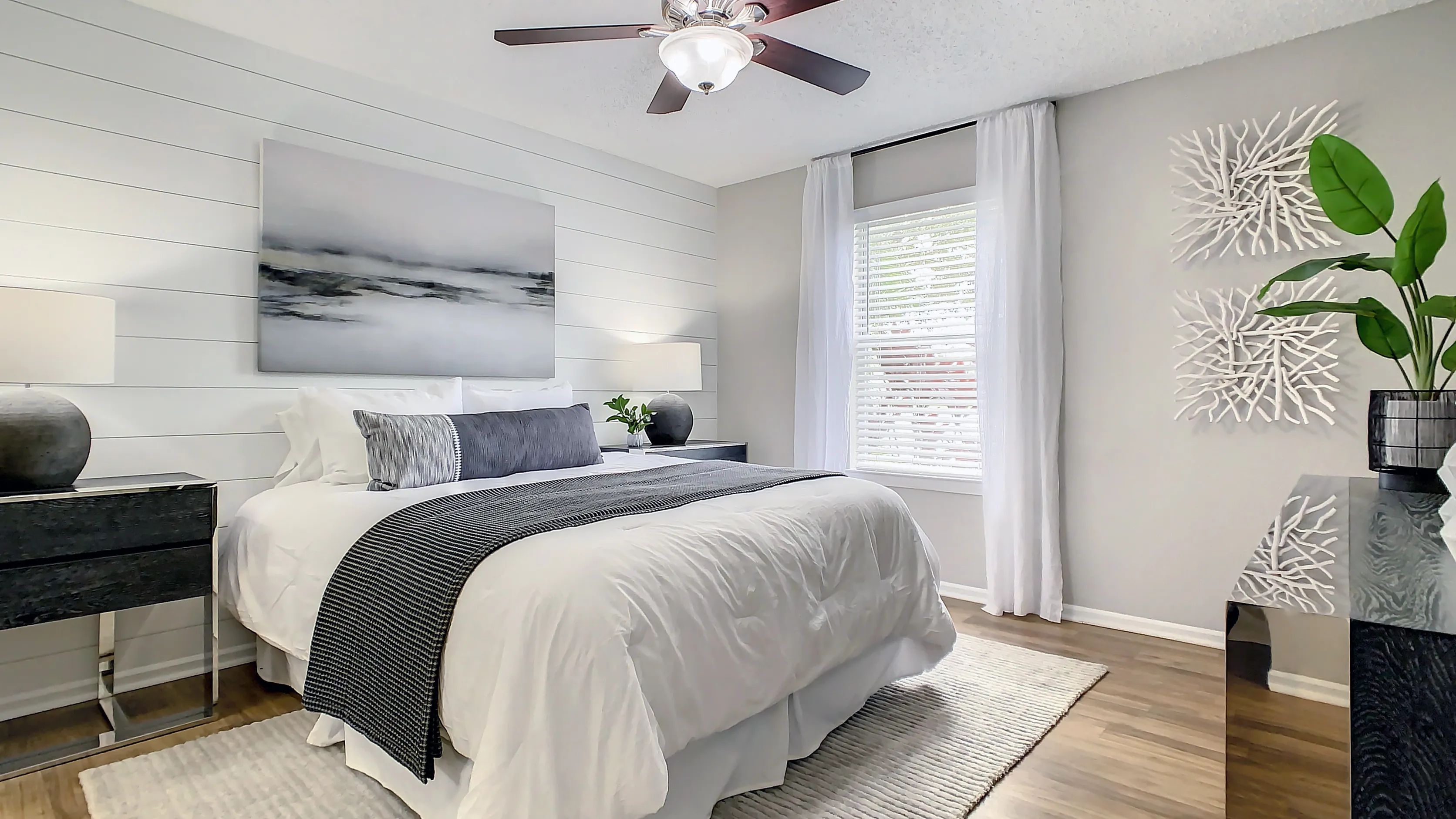 Revel in the allure of lavish primary bedroom spaces adorned with large windows and elegant flooring, a tranquil retreat for serene slumber. 