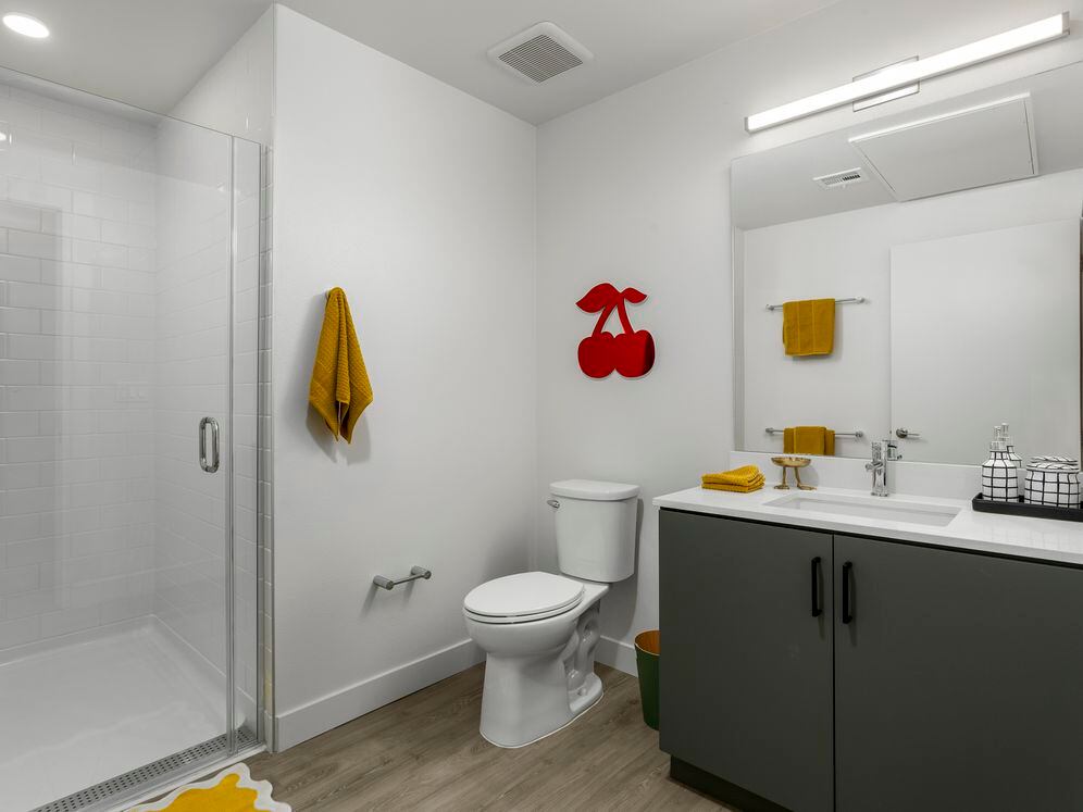 Finish Package II Bath with grey cabinetry, white quartz countertop, and hard-surface flooring