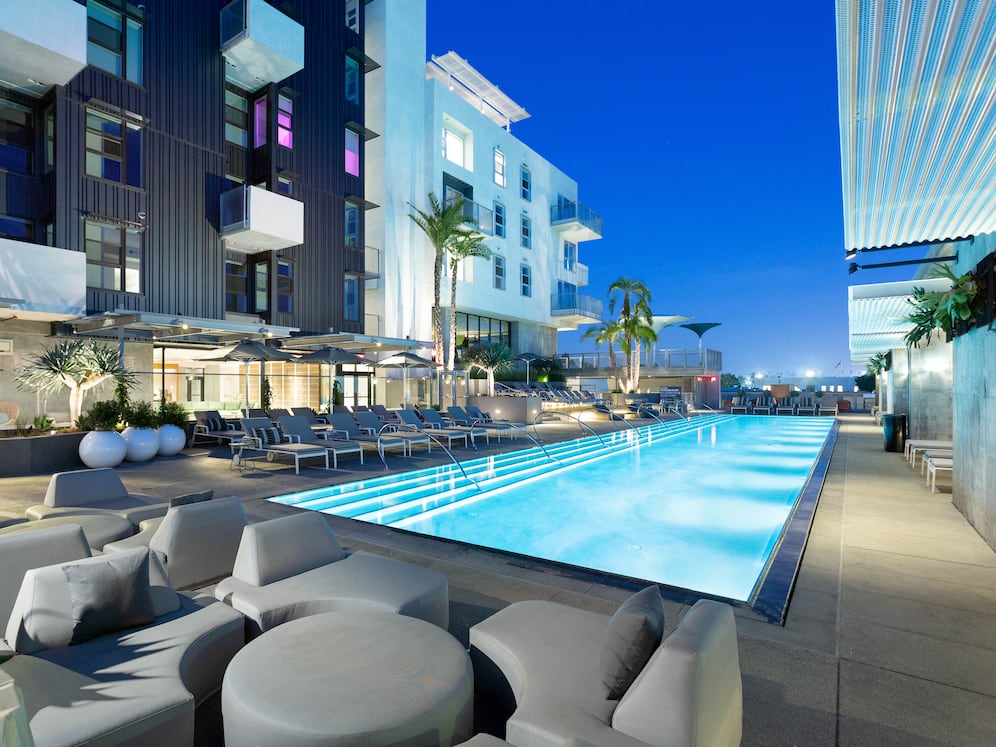 Pool and building exteriors at dusk