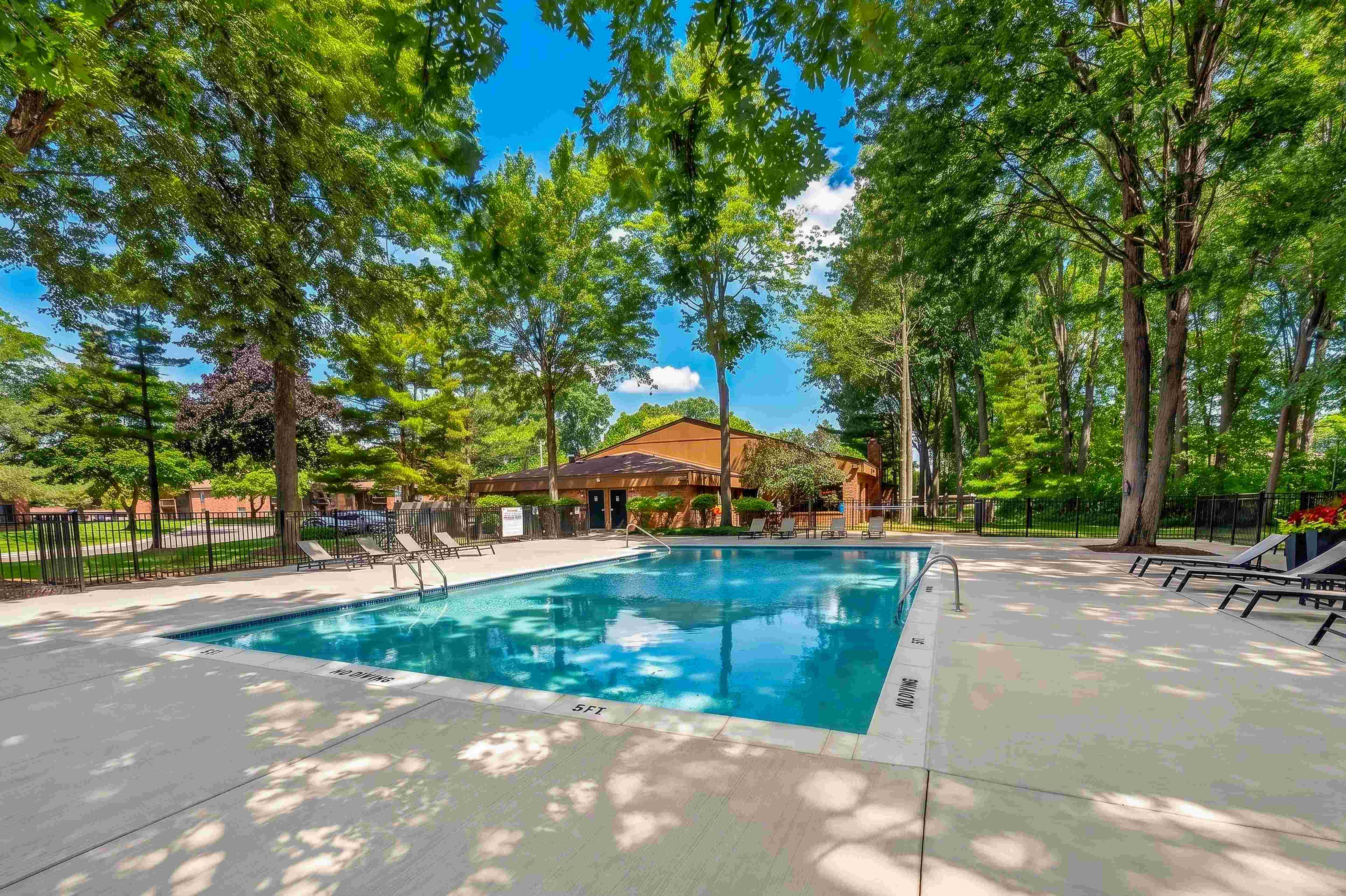 Heated swimming pool with sundeck at Eastwood Village Apartments in Clinton Township, MI.