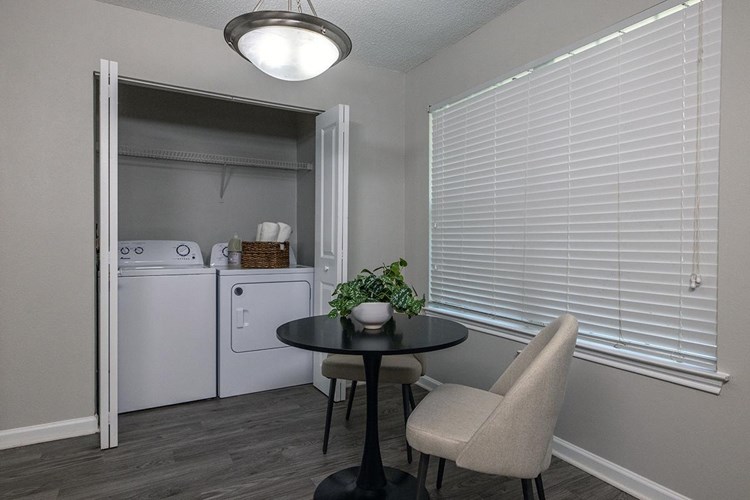 Convenient in-home laundry room area provides shelving for storage as well as full sized, energy efficient washer dryers included in every home!