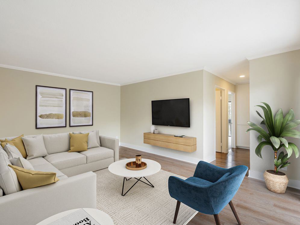 Renovated Package I living room with hard surface flooring