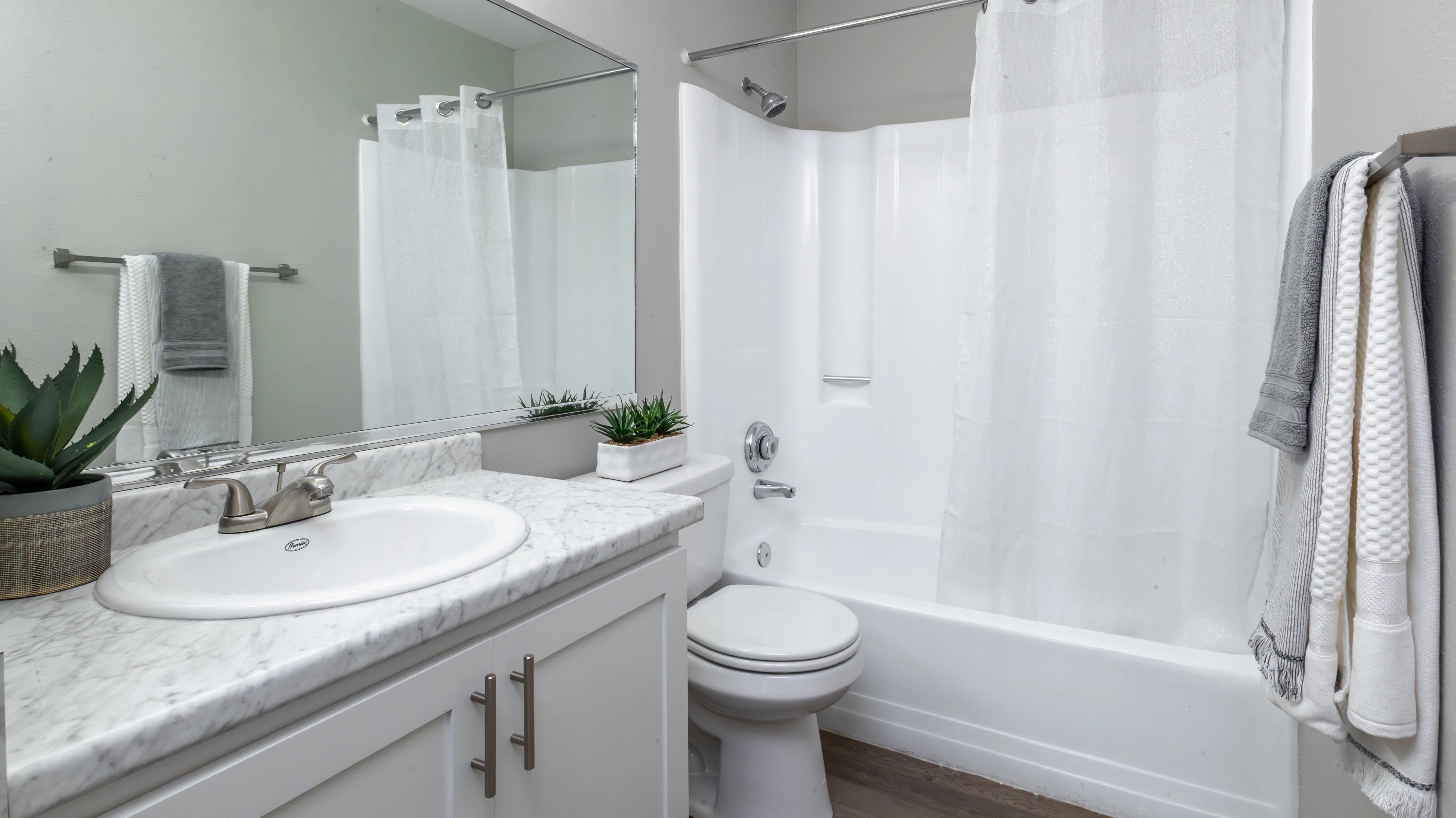 Lavish bathrooms renovated to perfection, featuring new countertops and cabinetry.