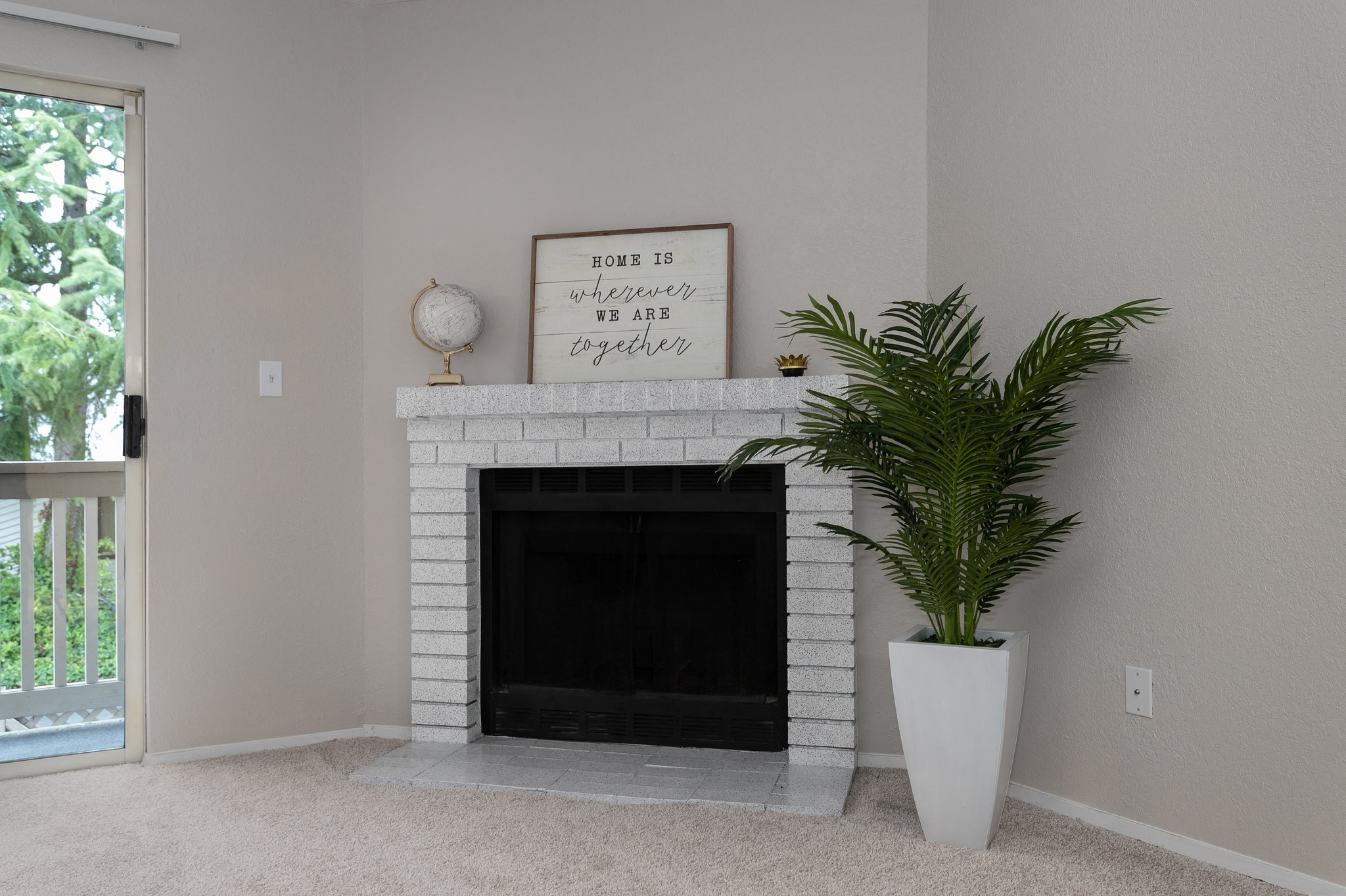 Bayview Apartment Homes Living Room Fireplace and Plant