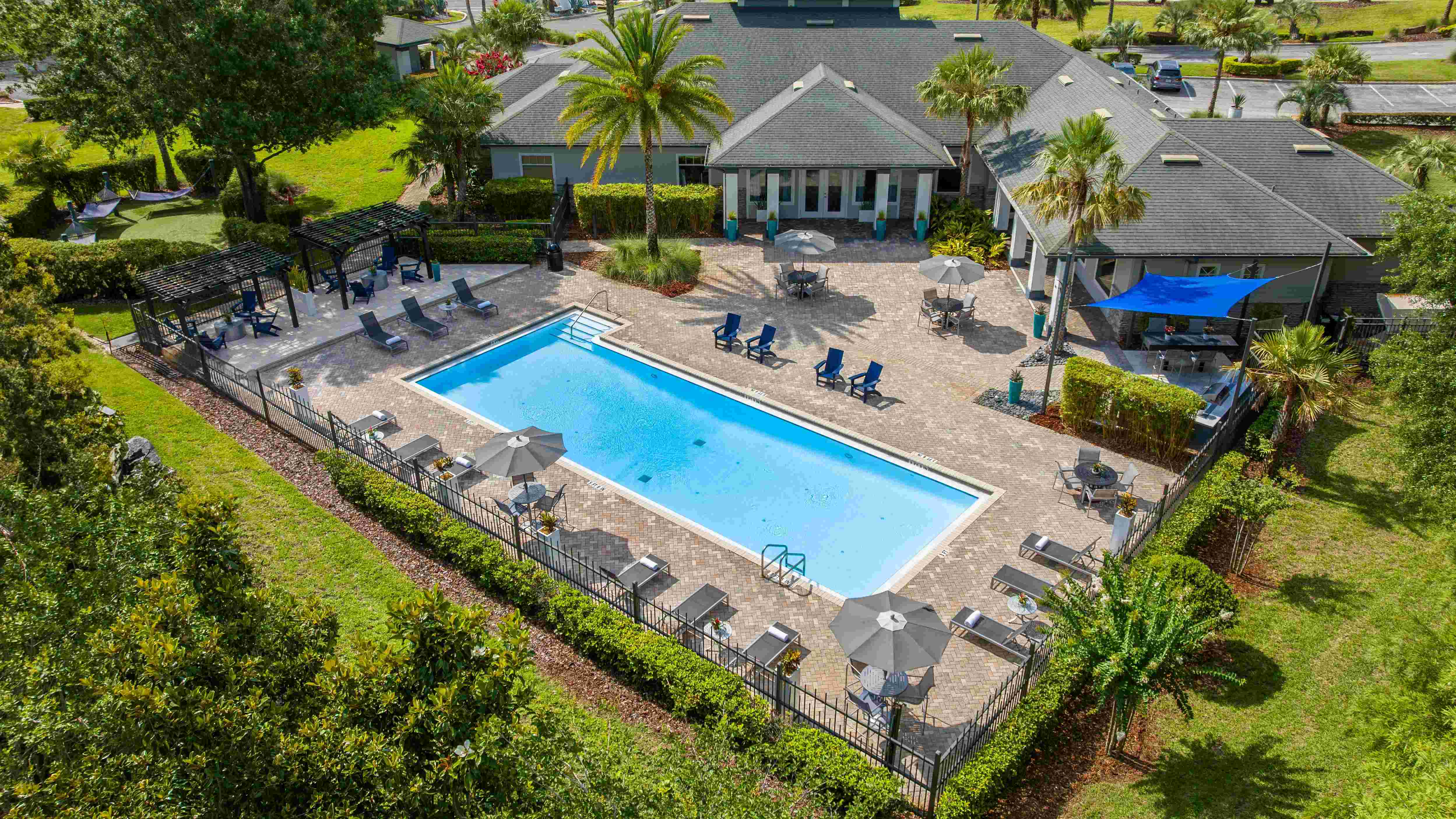 Take in the full layout of Elevate 155’s beautifully designed pool deck—featuring shaded pergolas, cozy hammocks, and plenty of lounge space to unwind.