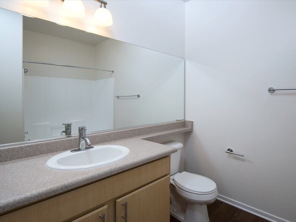 Classic Package II bath with laminate countertops, oak cabinetry, and hard surface flooring