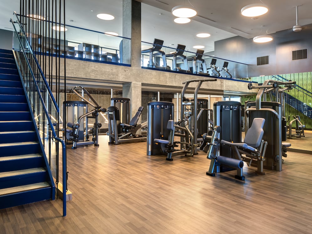 Two-level fitness center with cardio and strength equipment