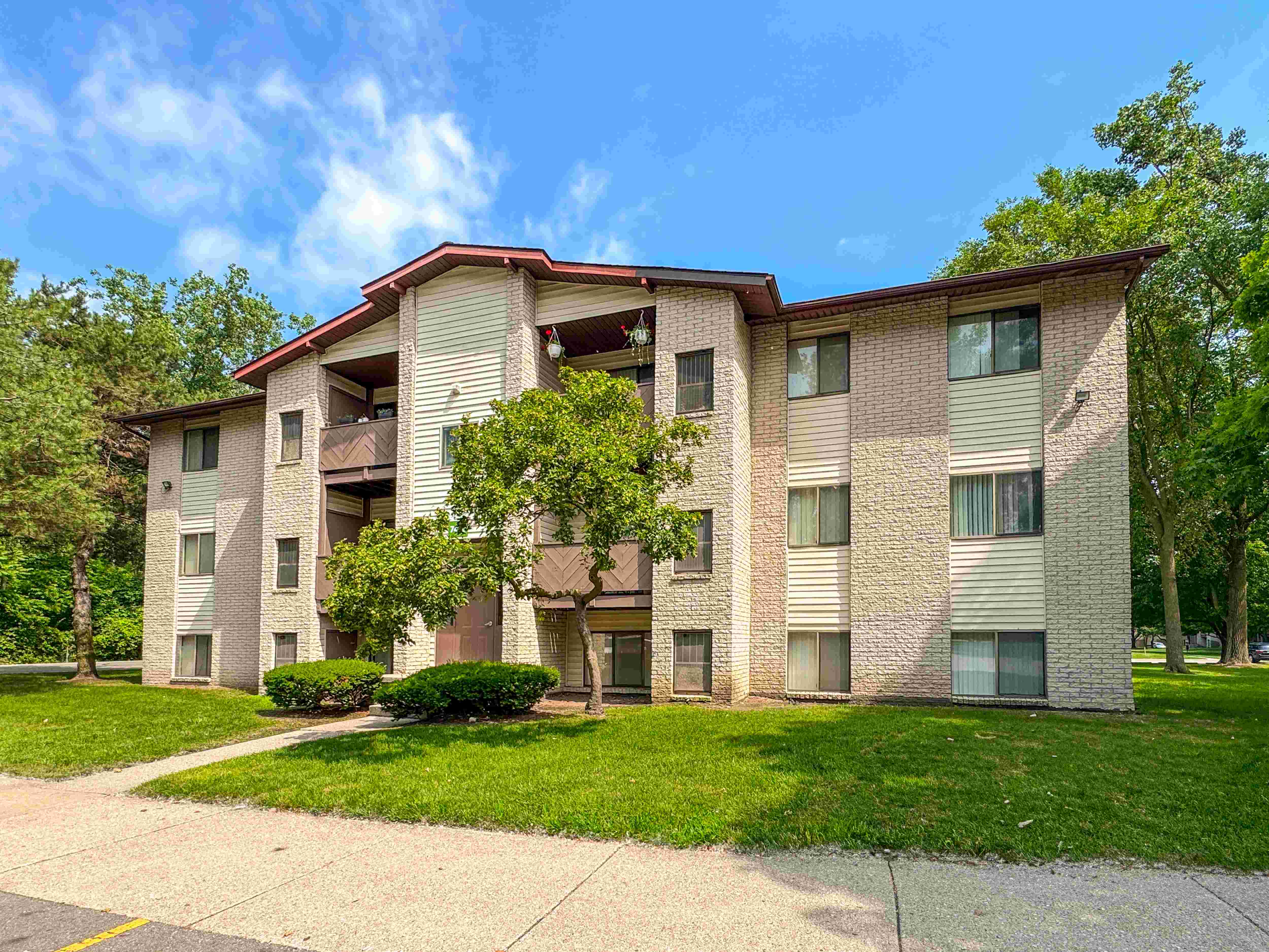 Exterior of cozy apartment homes at Woodland Villa Apartments in Westland, MI.