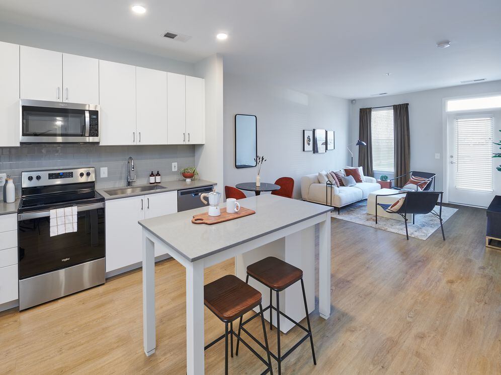 Design Collection II kitchen, living, and dining areas with hard surface flooring throughout