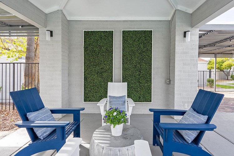 Have a seat in a tranquil setting by the pool.