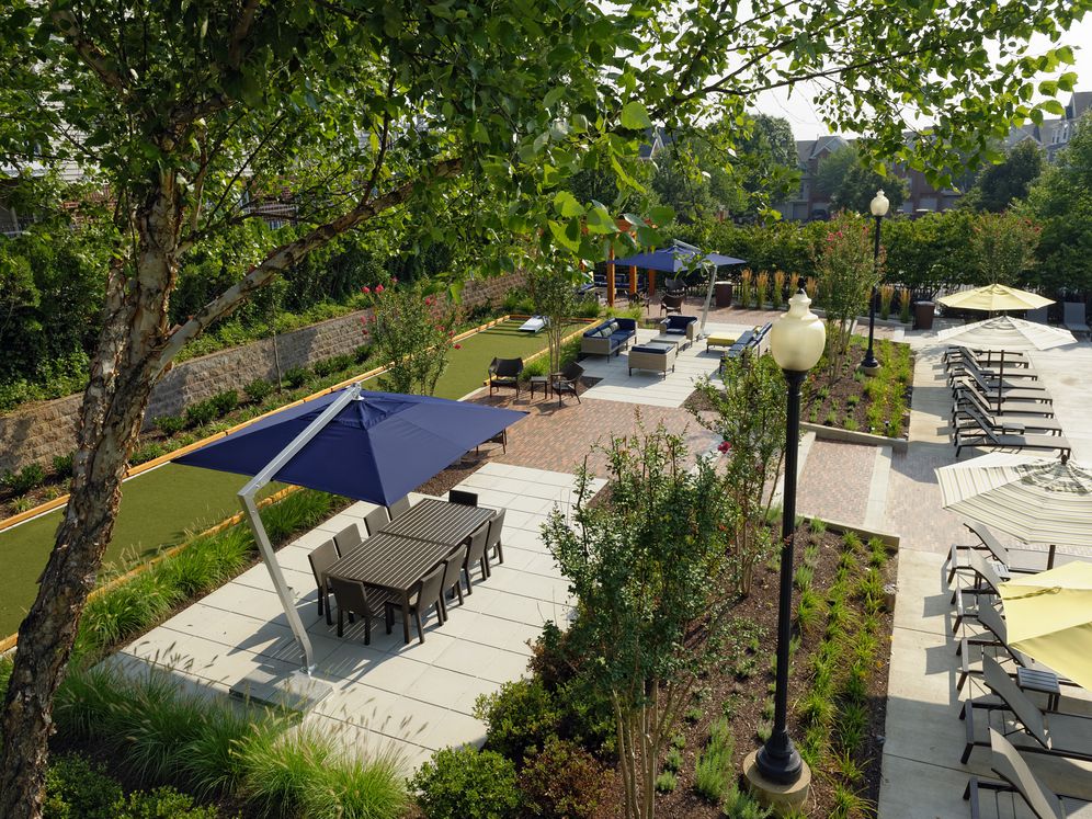 Courtyard with dining area, lounge seating and outdoor gaming area