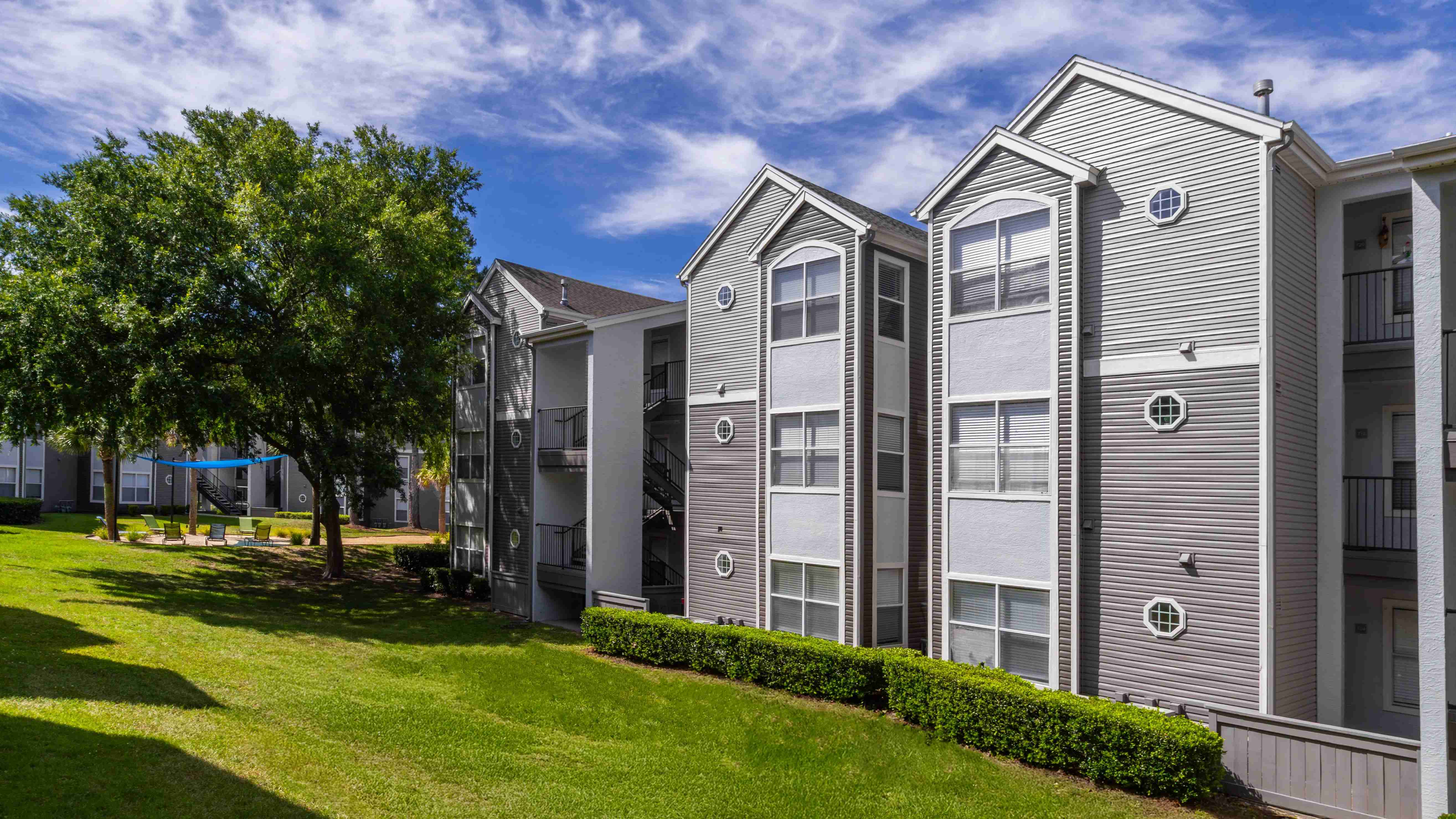 Surrounded by mature trees and open green space, The Enclave offers freshly painted buildings in a serene setting just steps from your front door.