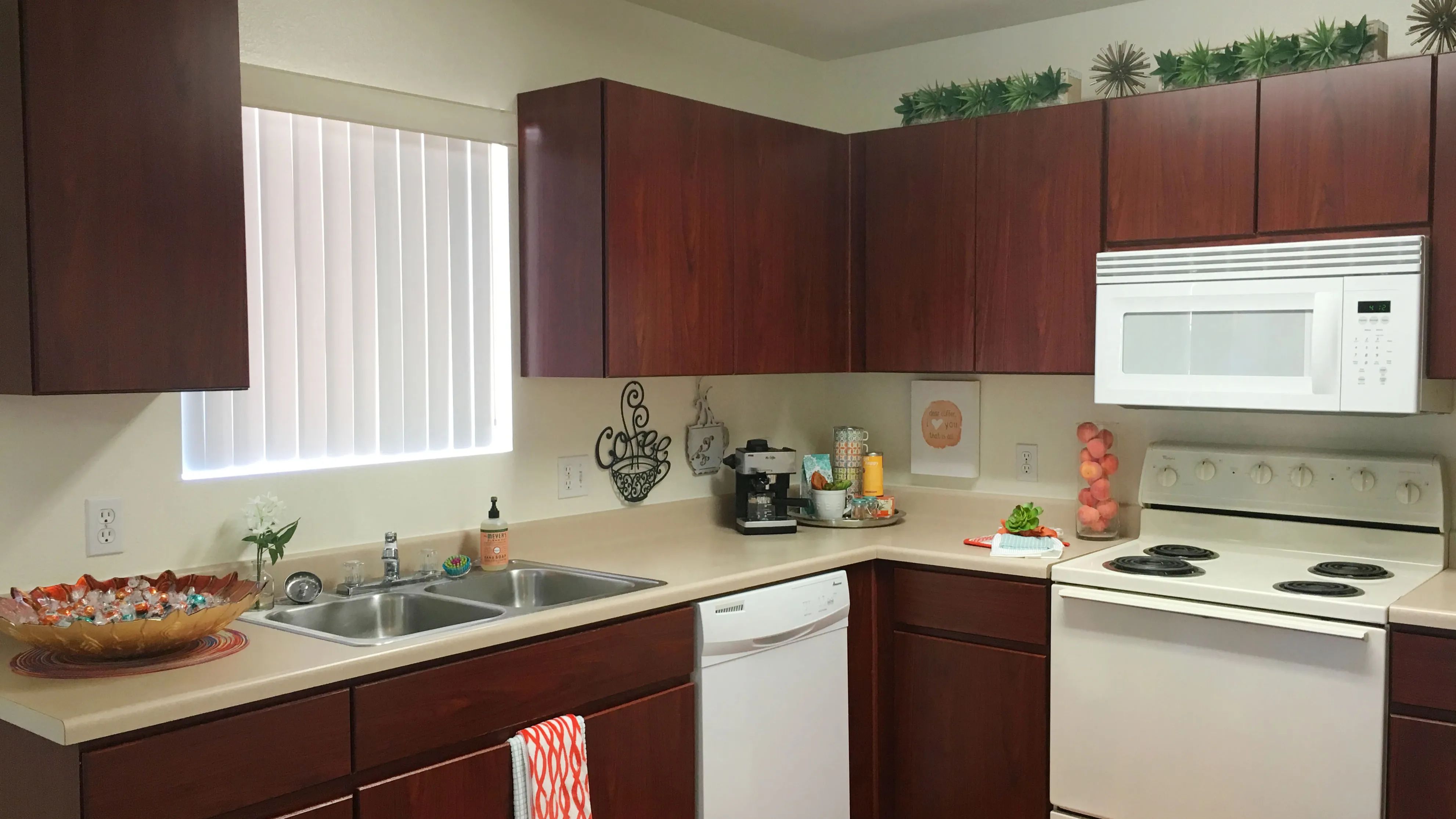 Experience the charm of our timeless kitchen design, complete with ample countertops for meal prep and abundant cabinets for storage.