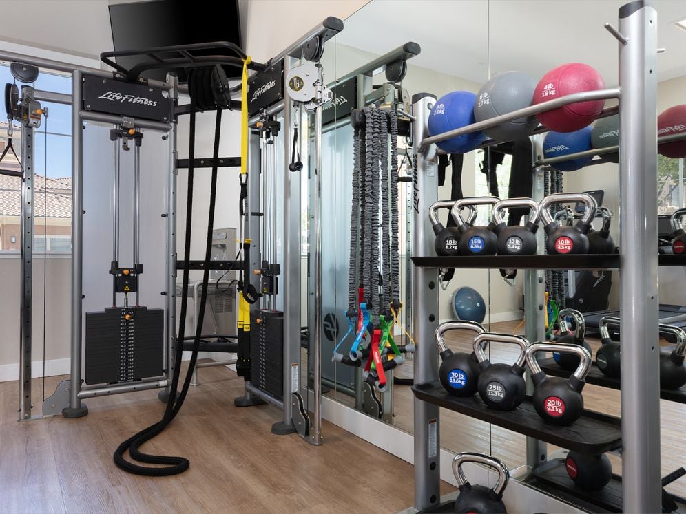 State-of-the-art fitness center with cardio equipment, strength equipment, and free weights