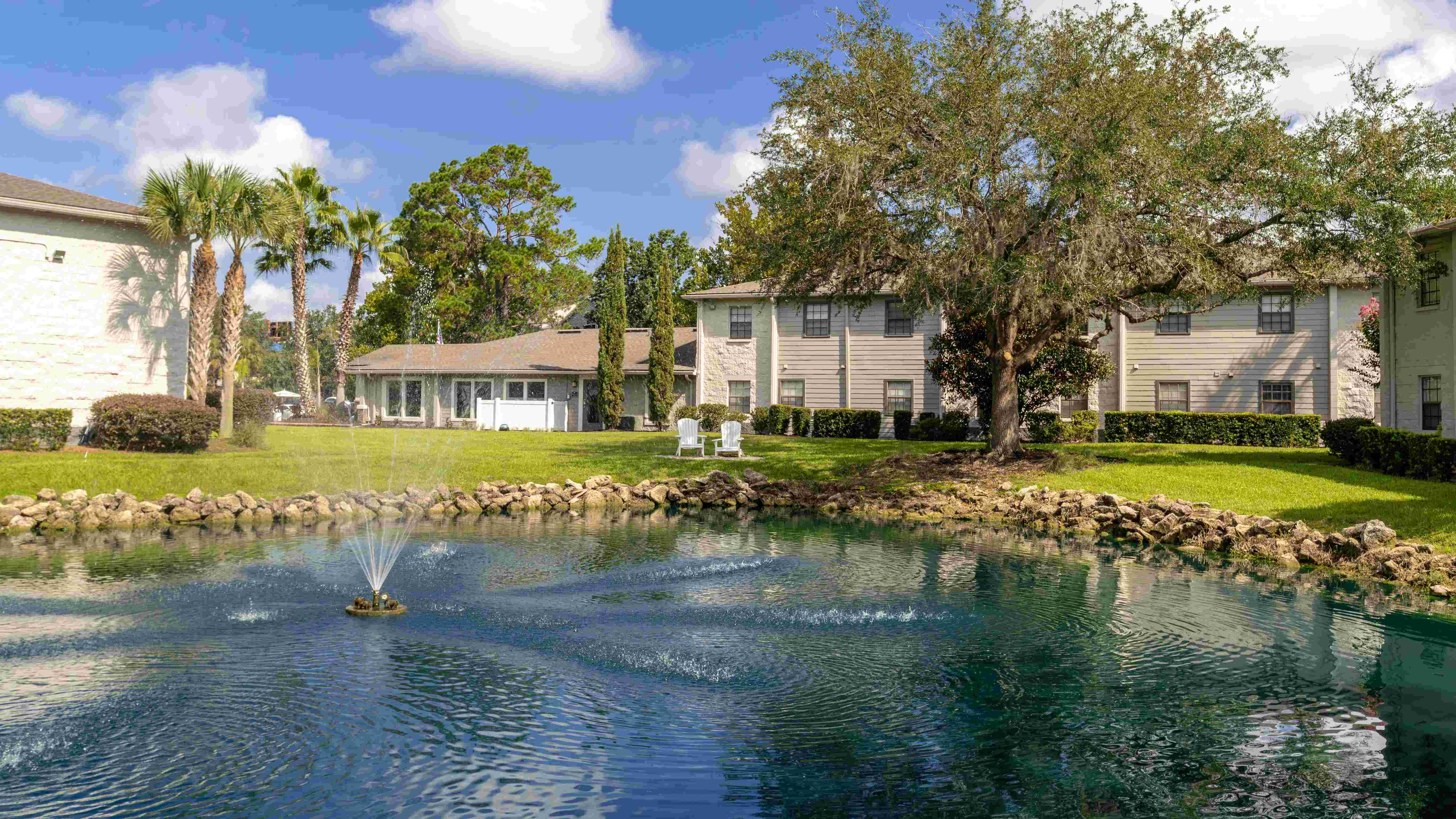 Immerse yourself in a peaceful oasis with soothing waters and verdant surroundings.