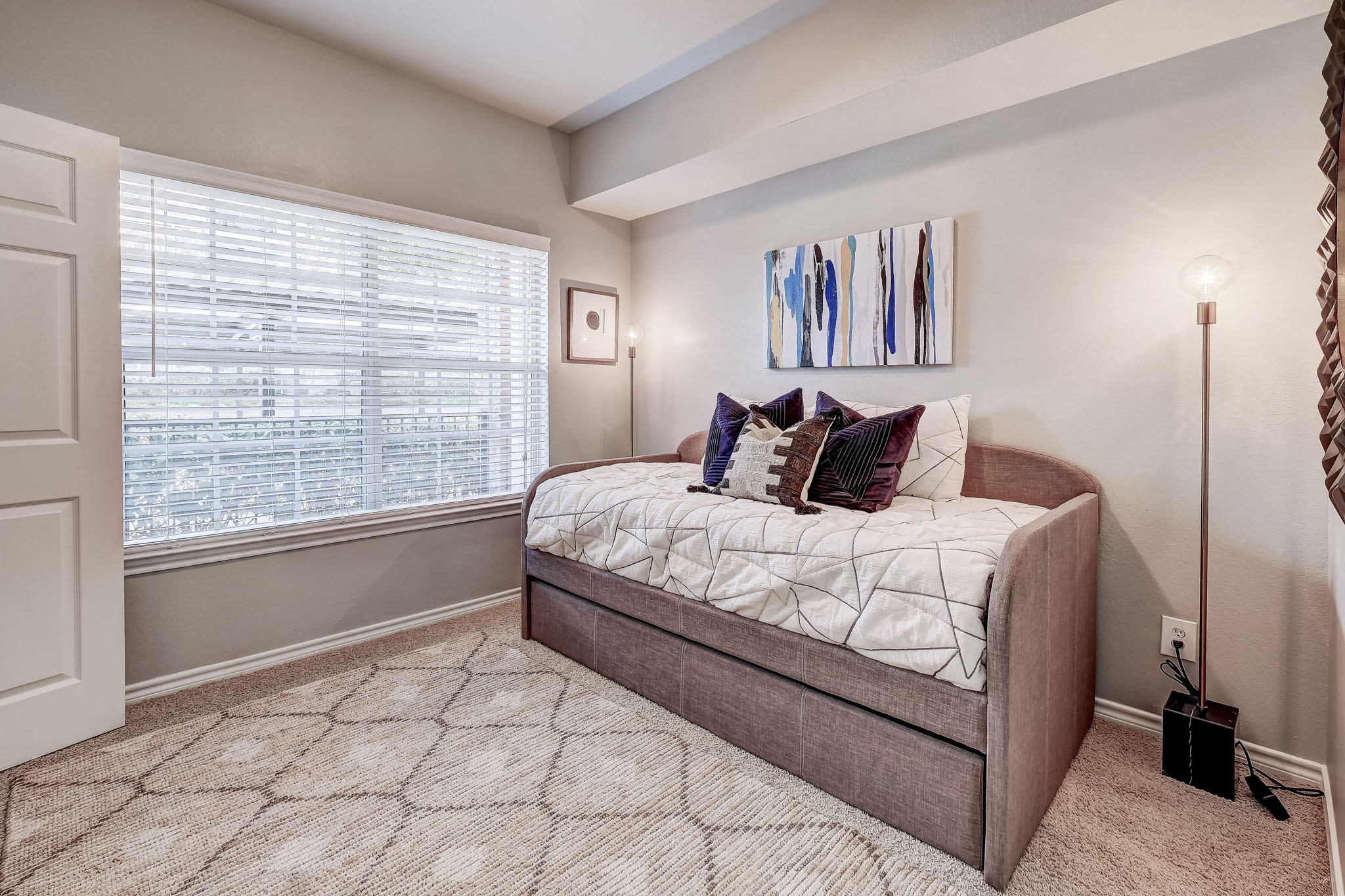 Second bedroom with plush carpet and high ceilings