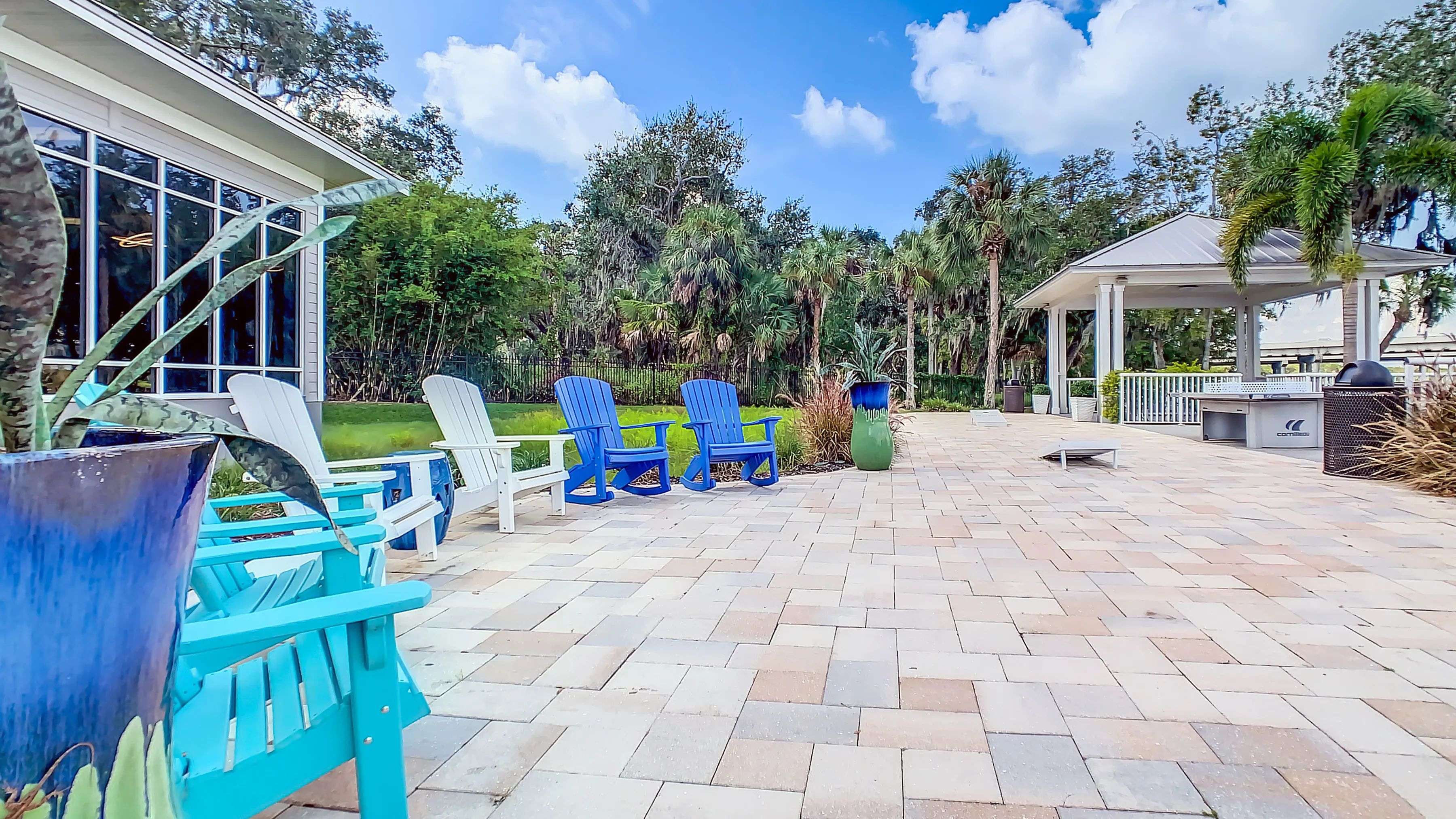 Watch or join in the excitement at the open-air game area boasting a ping pong table and cornhole boards. Whether playing or relaxing, the riverside ambiance enhances every moment of outdoor amusement. 