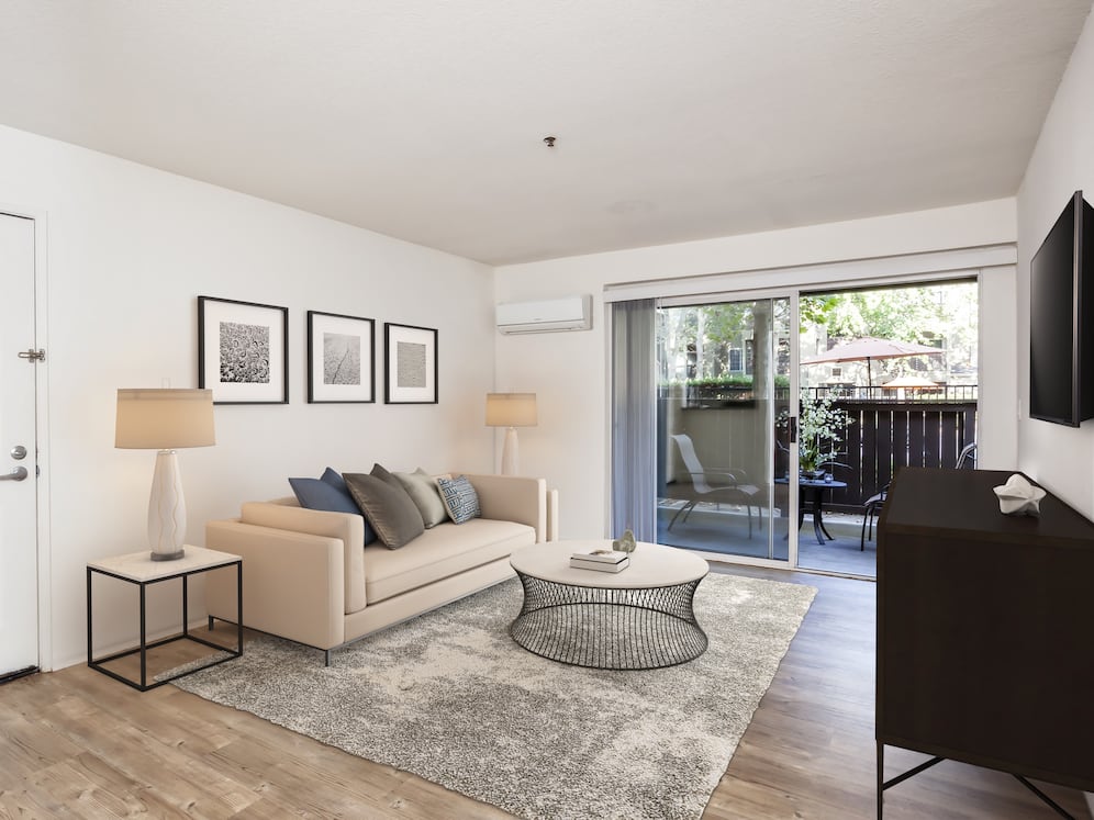 Classic Package living area with balcony access and hard surface flooring