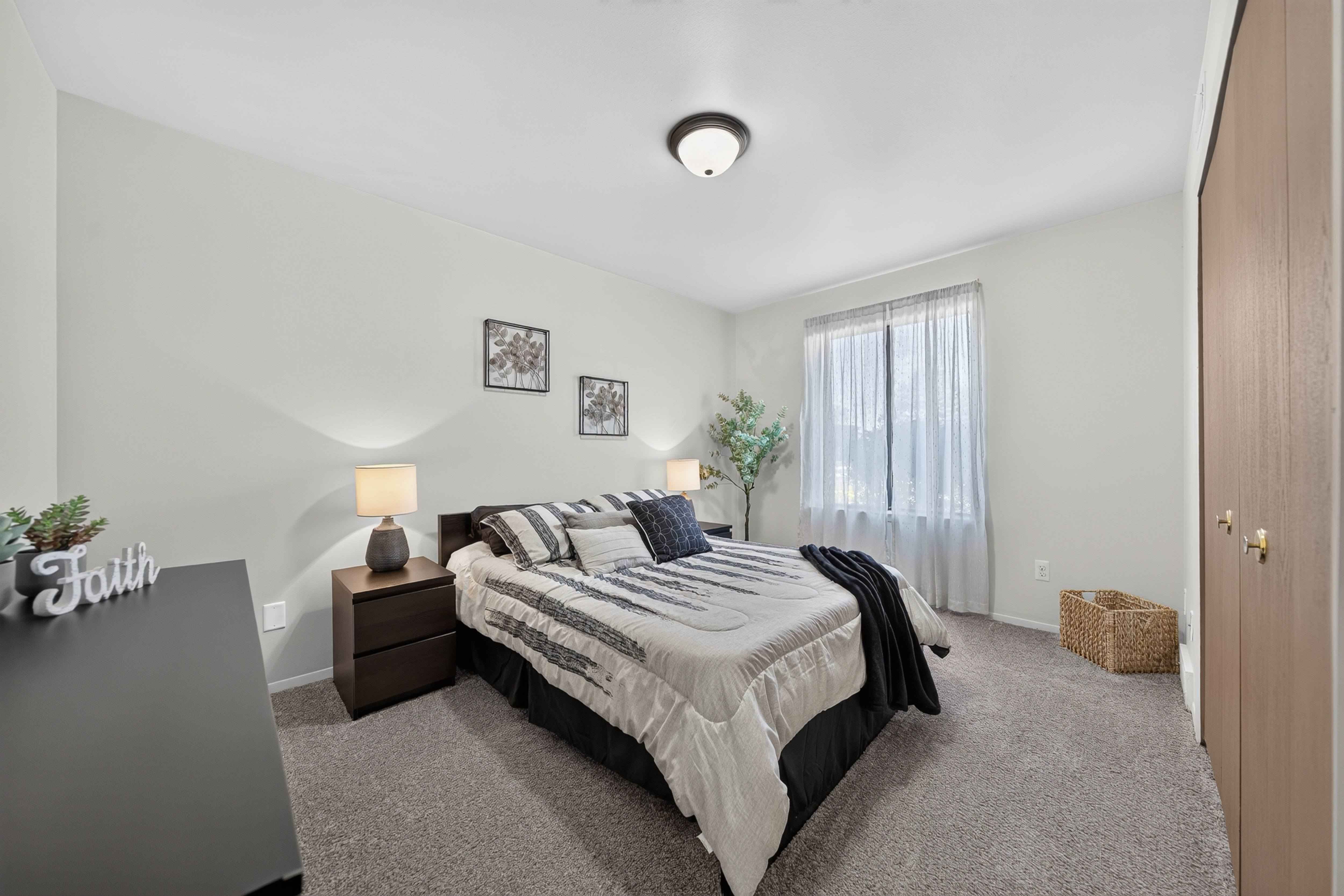 Spacious bedroom with ample storage space at Eastwood Village Apartments in Clinton Township, MI.