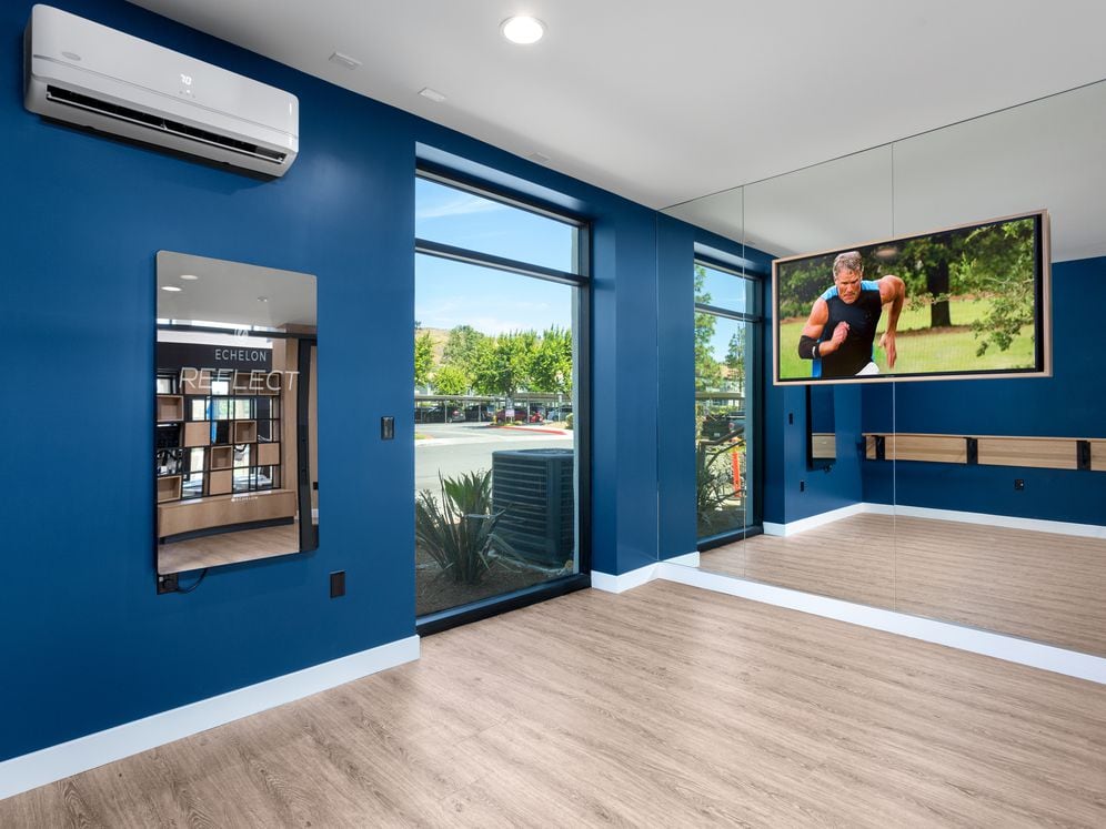 Fitness center studio room with Mirror virtual fitness technology