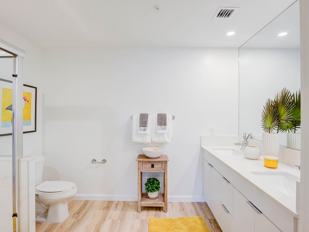 East Phase Bath with white cabinetry, white countertop, and hard surface flooring