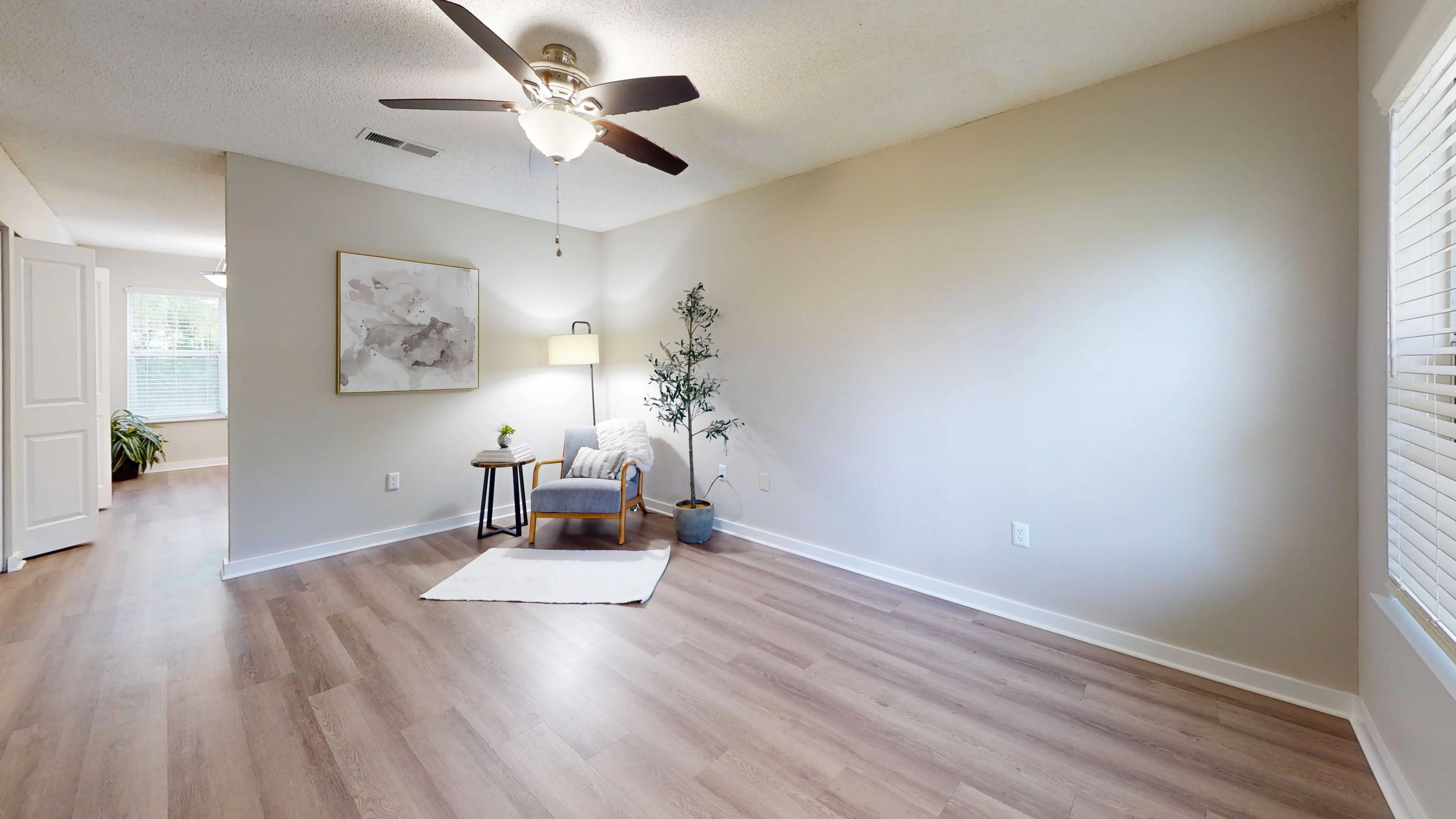 Illuminate your days in our sun-drenched apartment, where elegant wood floors seamlessly guide you from the inviting entry to the heart of the home—the vibrant and stylish kitchen.