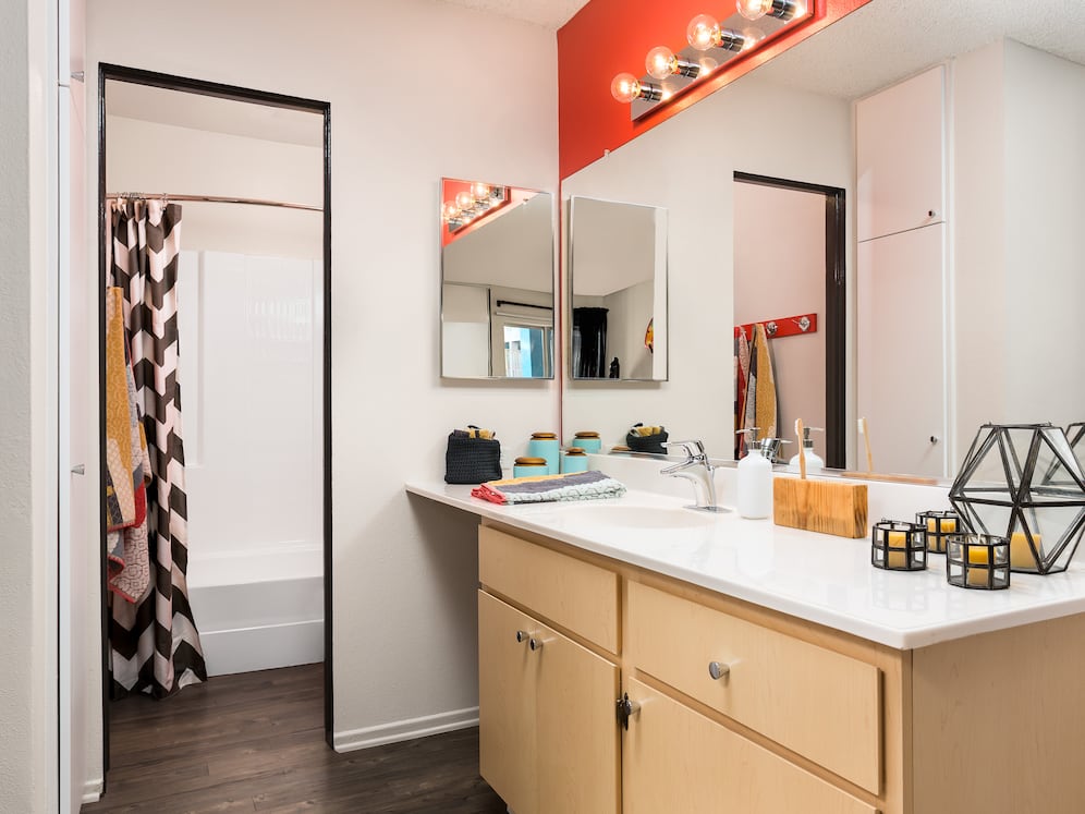 Classic Package II bath with white laminate countertop, oak cabinetry, and hard surface flooring