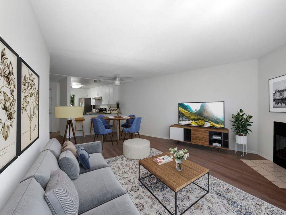 Renovated Package I living room with hard surface flooring