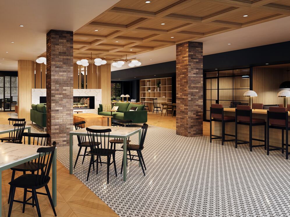 Leasing and lobby area with lounge seating, fireplace, and coworking spaces (rendering)