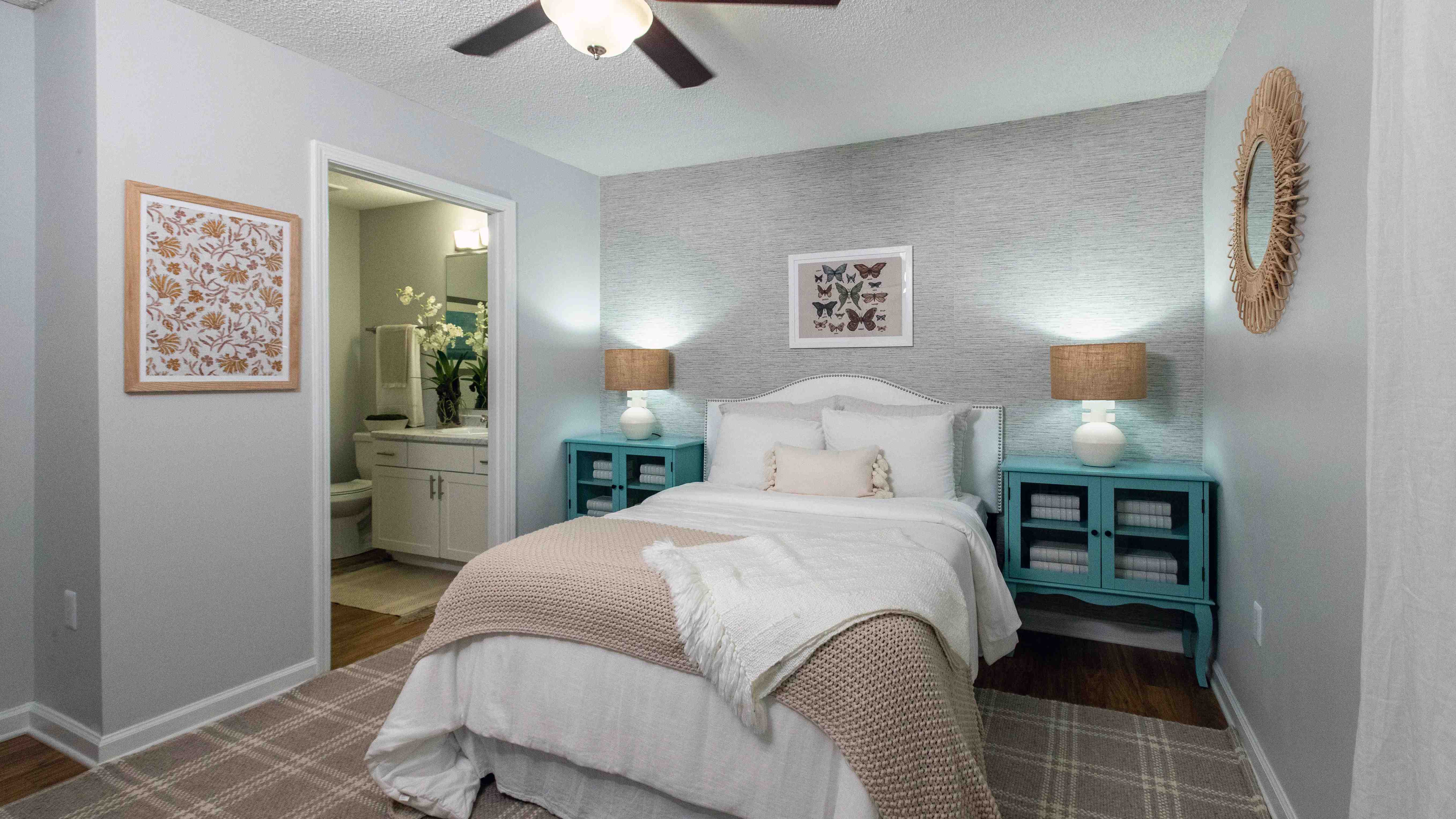 Step into the serenity in our primary bedroom at Emerson Isles. The private access to your en suite bathroom and the comforting breeze from the ceiling fan create a haven of tranquility.