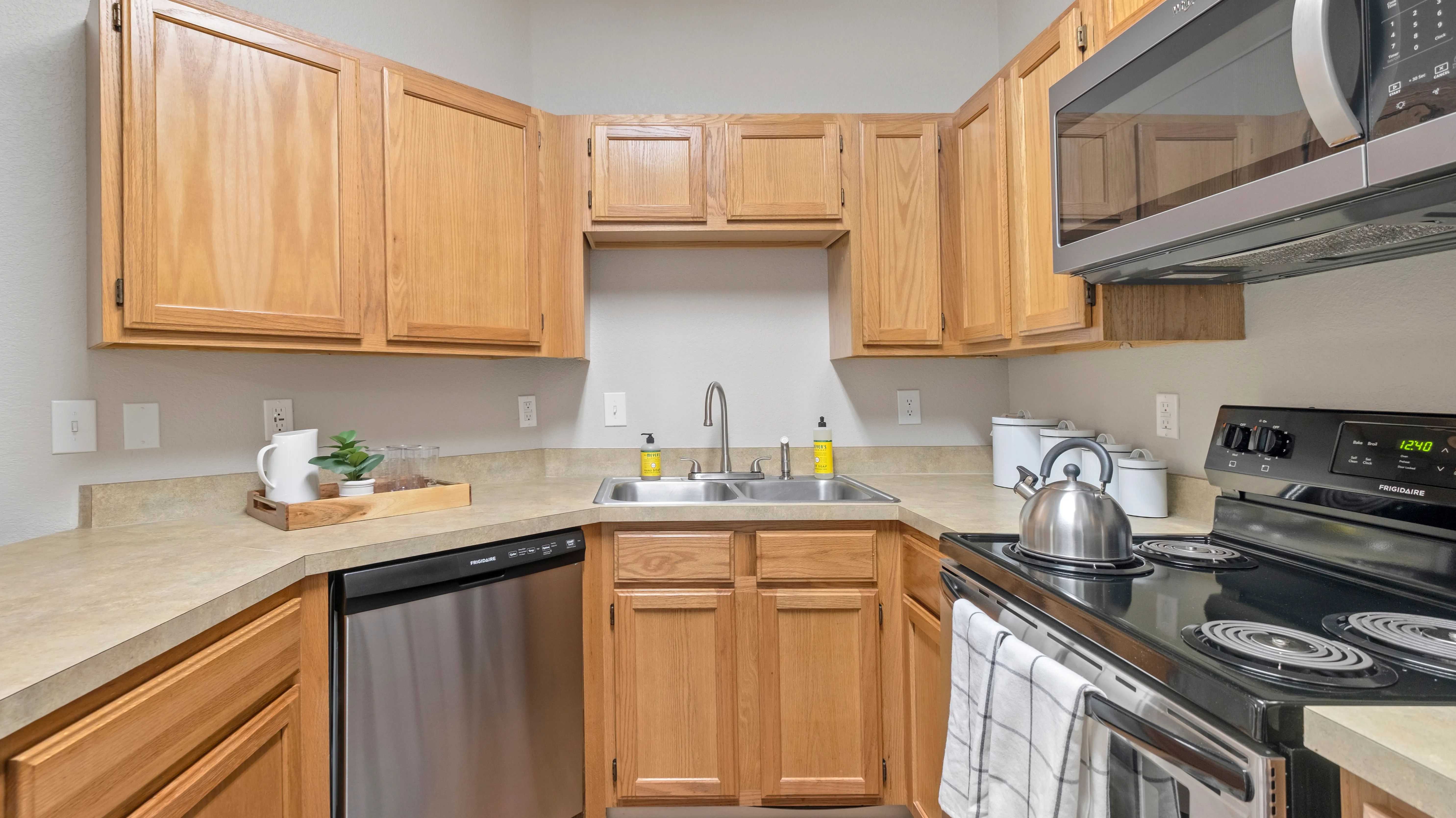 Savor the convenience of a breakfast bar, providing a perfect setting for meal prep and open conversations.