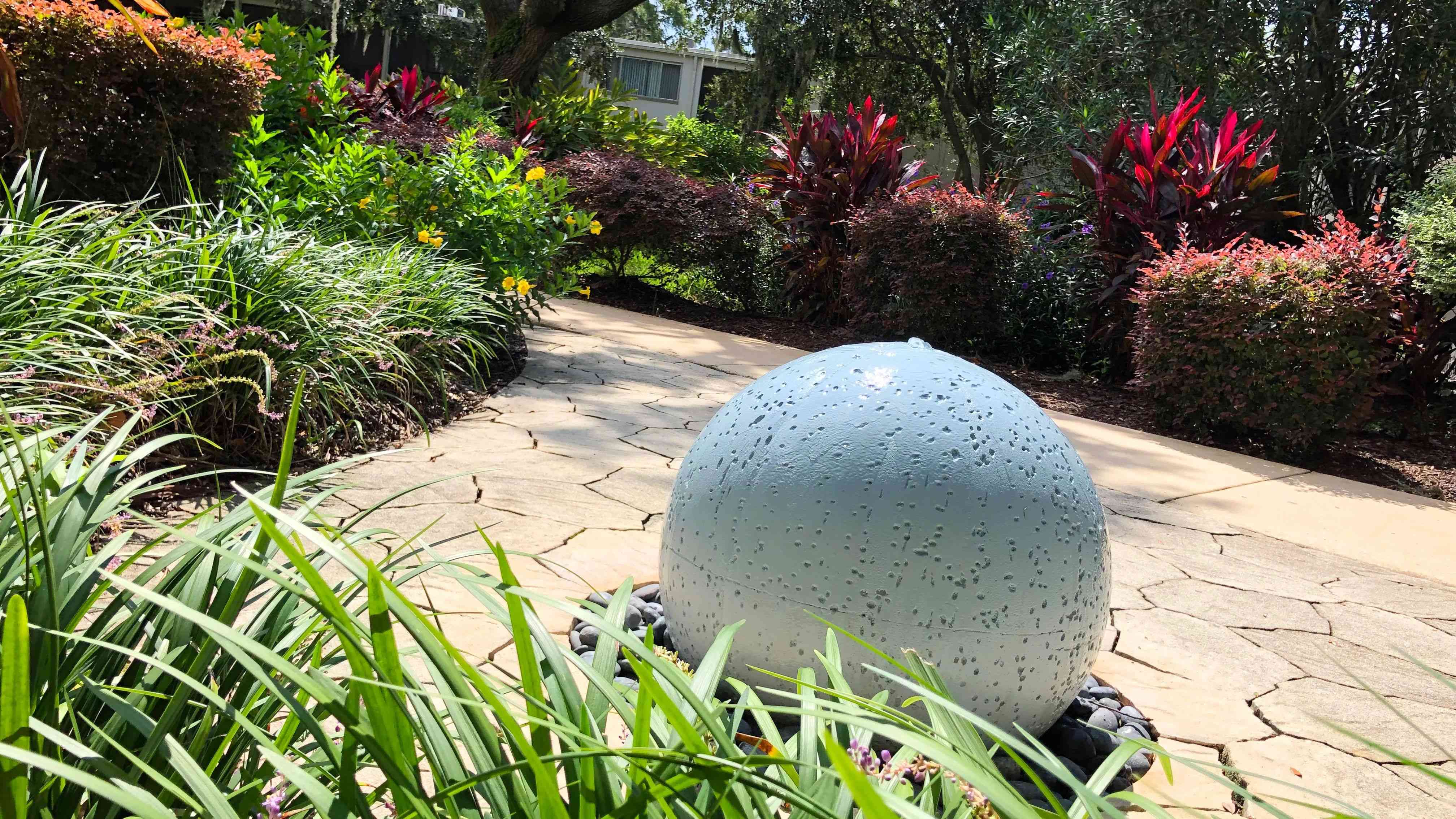 Find tranquility in our Zen Garden featuring a beautiful water feature and elegant tropical landscaping.  