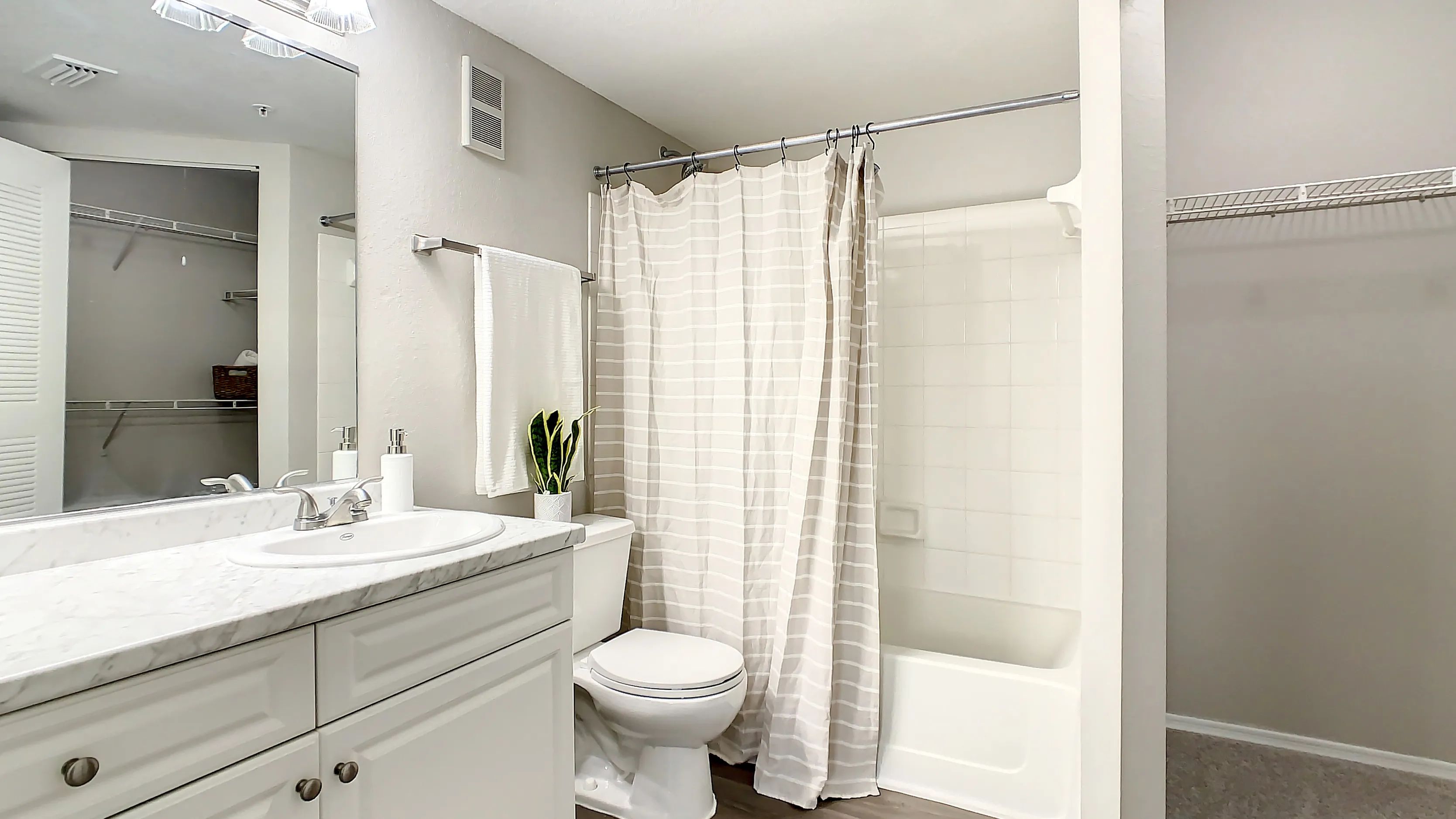 Your oversized primary bathroom offers plentiful storage options including storage drawers, a convenient linen closet as well as a connecting, large walk-in closet. 