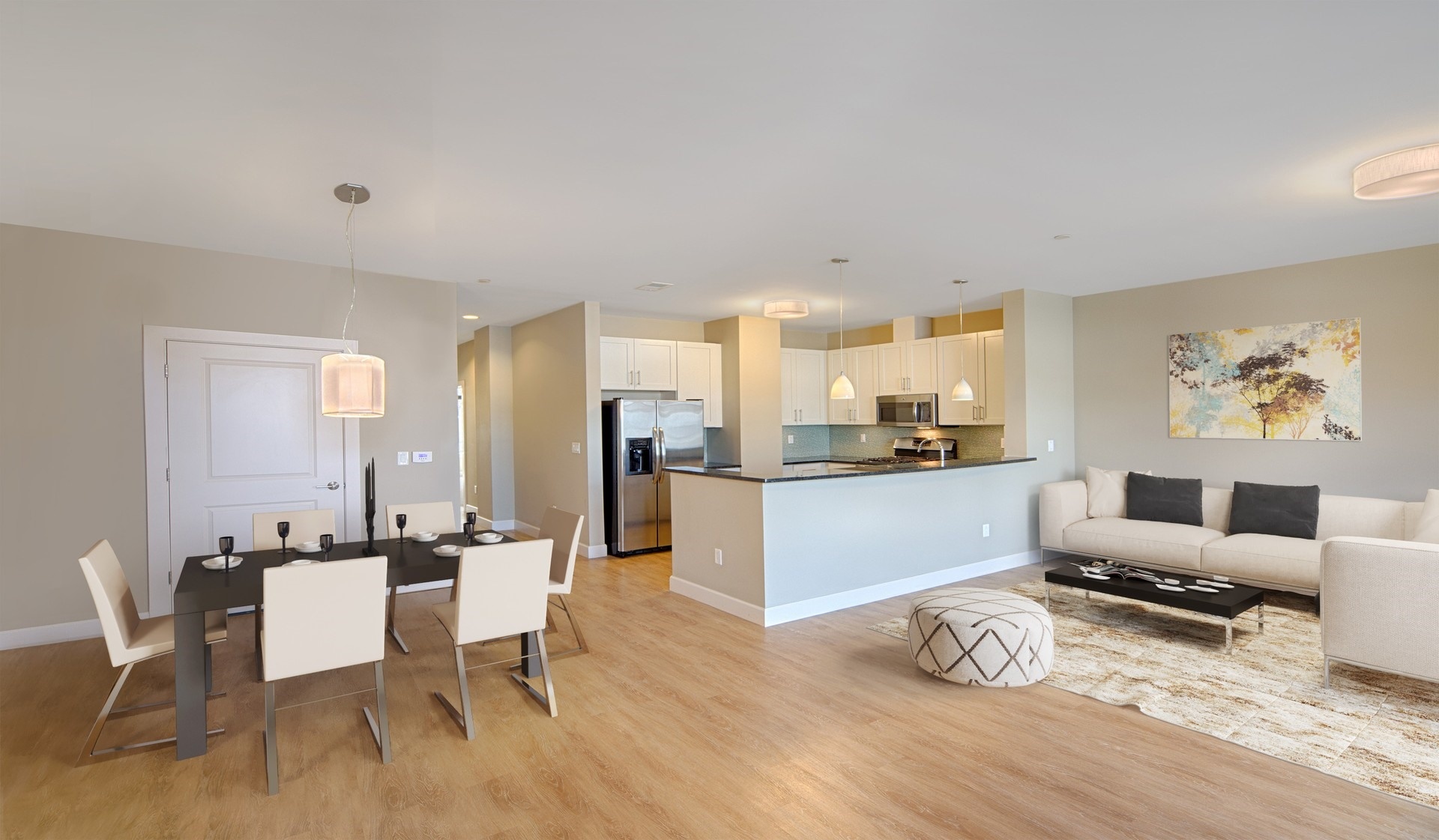 Spacious living rooms feature wood flooring throughout and open to kitchen