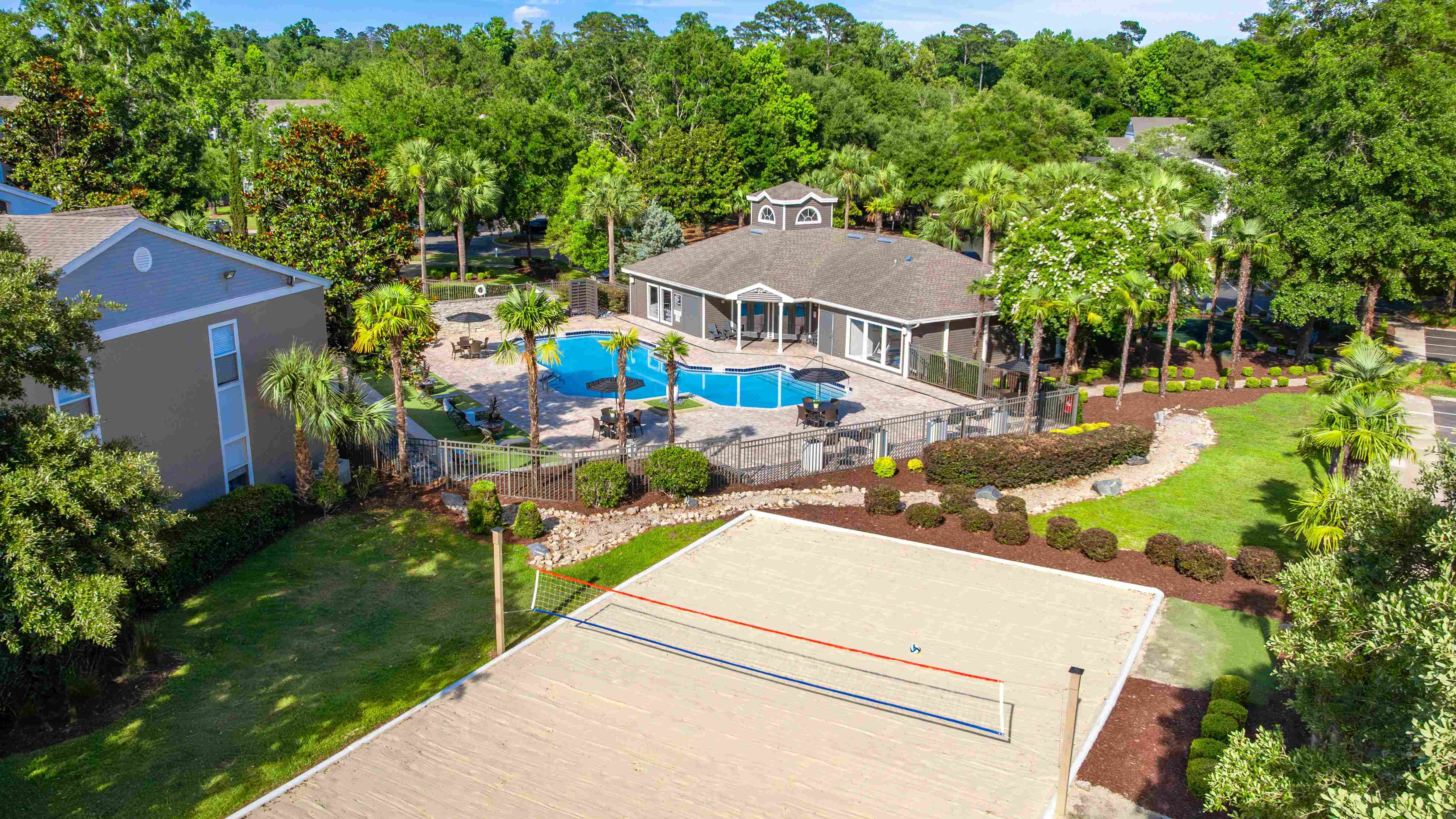 From competitive volleyball matches to poolside lounging, this aerial view captures the energy and beauty of life at Oasis at 1800.