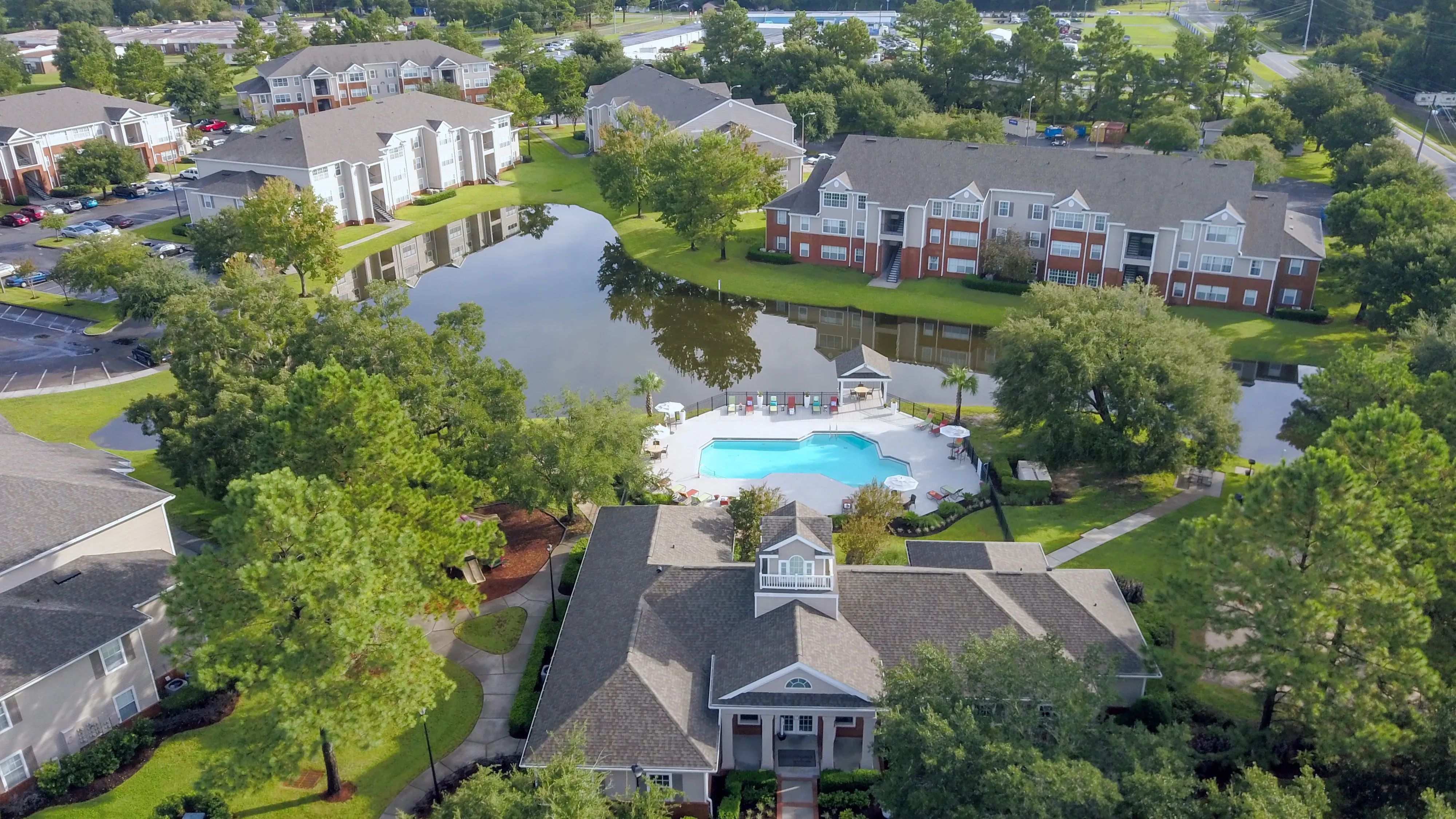 Savor the panoramic splendor of Eagle's Pointe in Brunswick, Georgia, from high above. An enchanting haven where the lake glistens, greenery flourishes, and a vibrant community thrives.