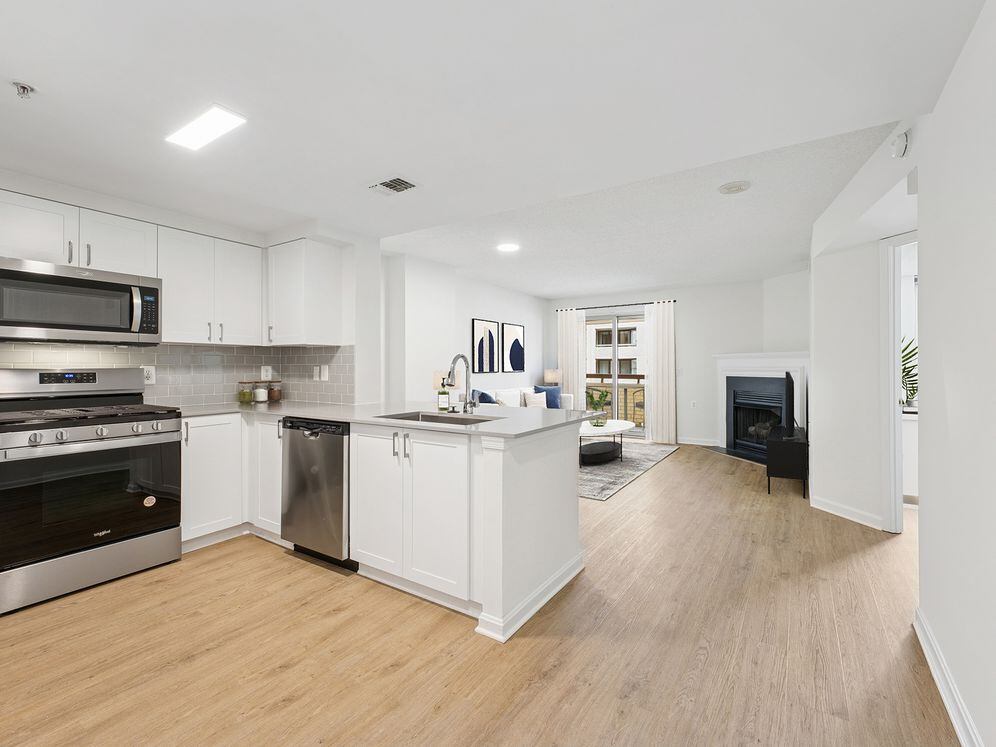 Renovated Package II kitchen and living room with hard surface flooring