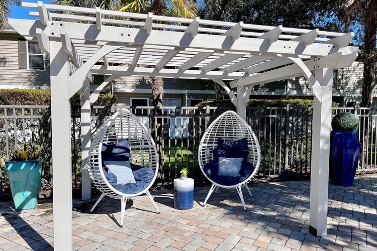 Relax and get some shade under our poolside pergola.