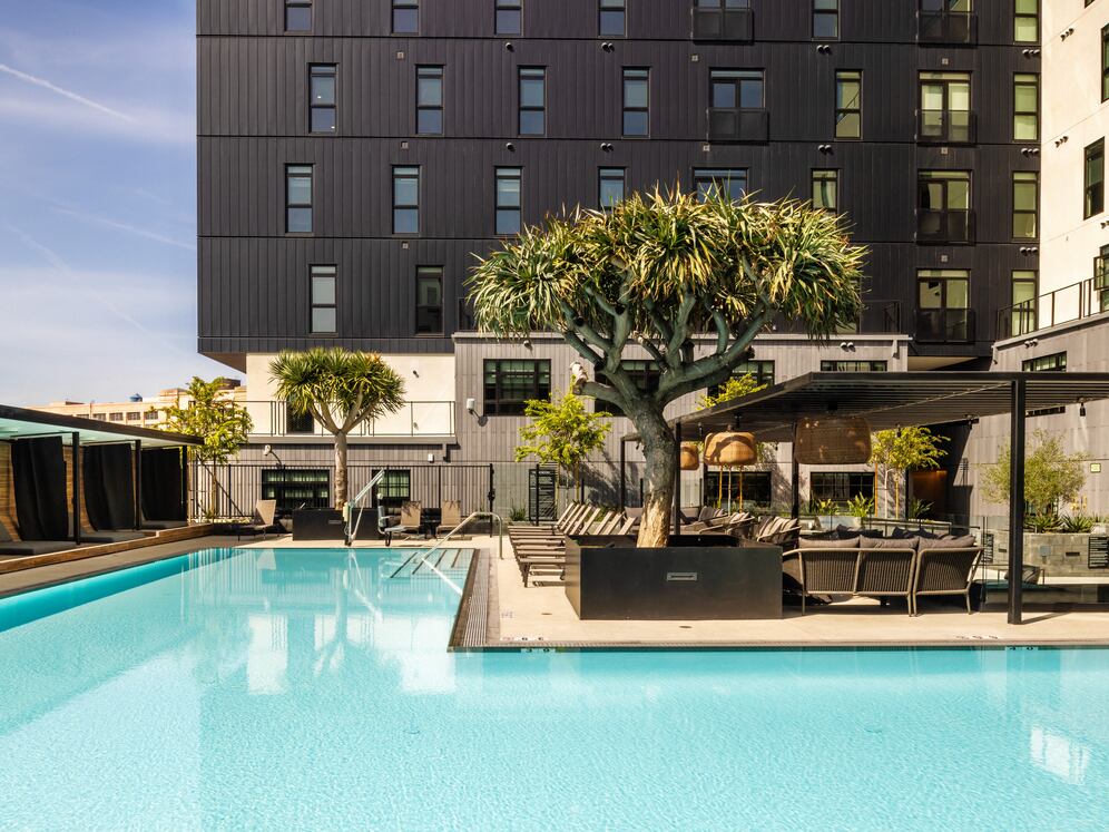 Pool and sundeck with cabanas