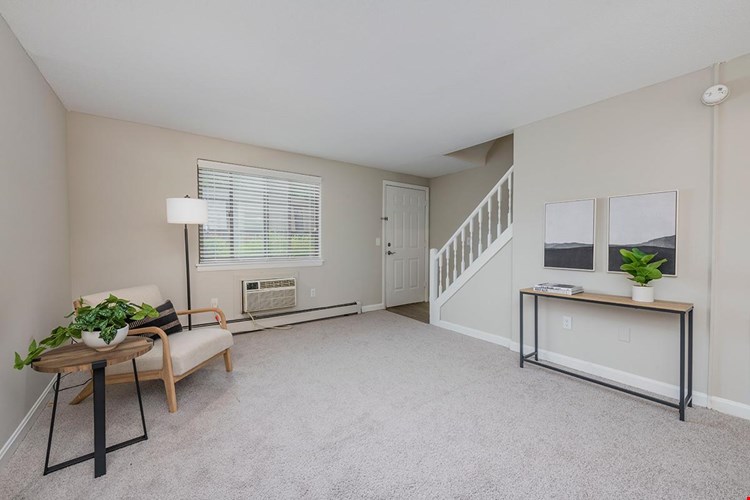 Living area that opens to the kitchen and half bath.