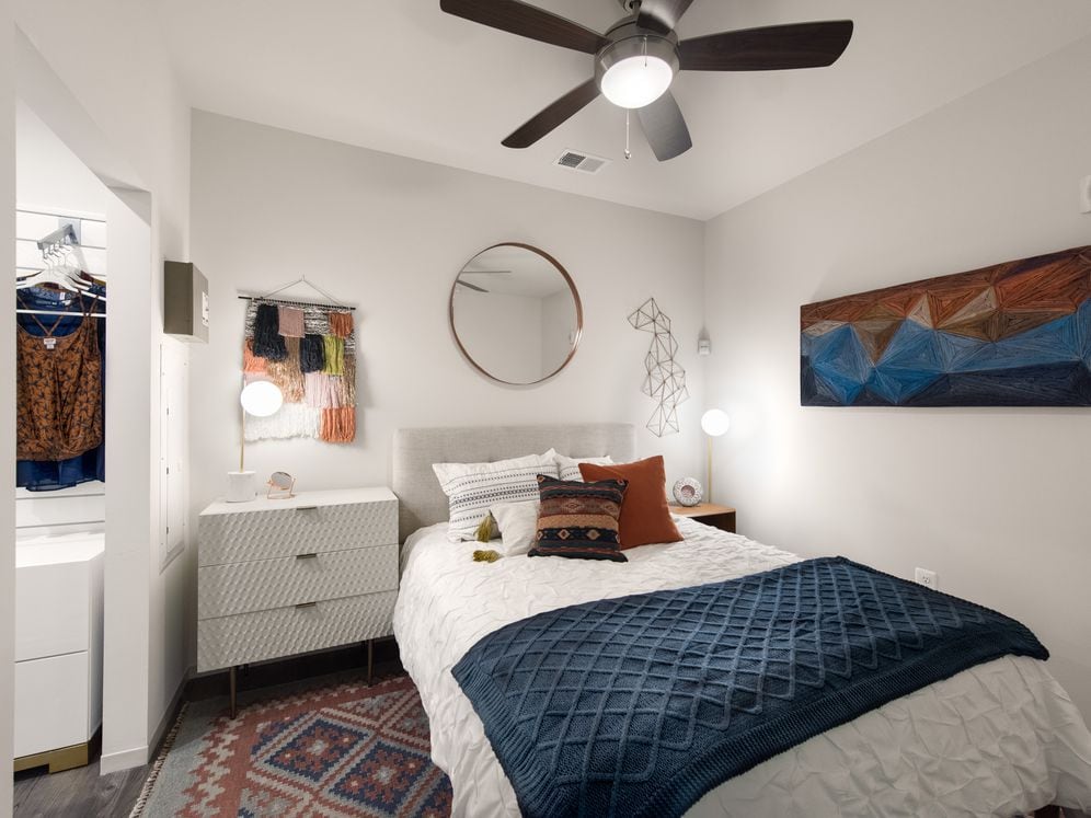 Bedroom with ceiling fan and hard surface flooring