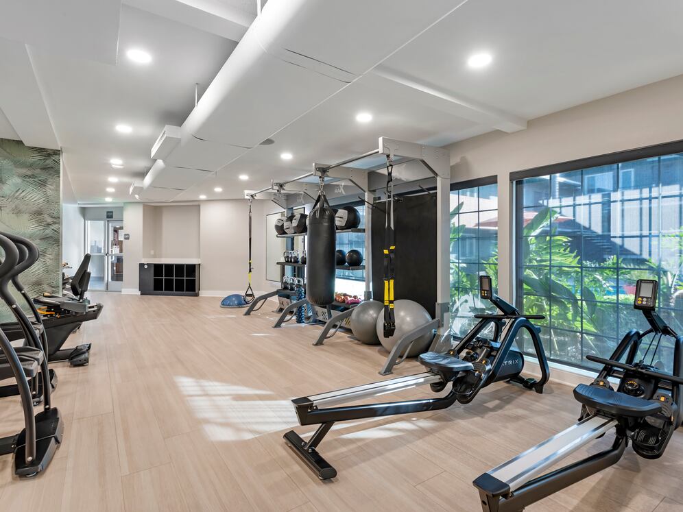 Fitness center with cardio and TRX equipment