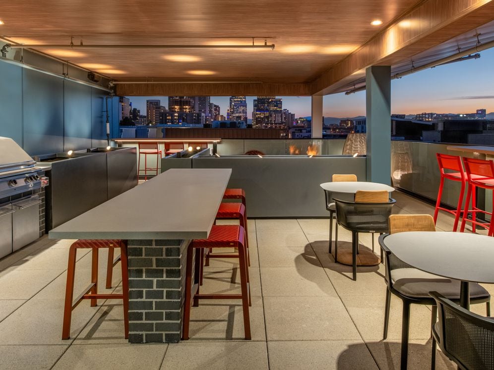 Rooftop lounge with bbq grills, fireplace and seating