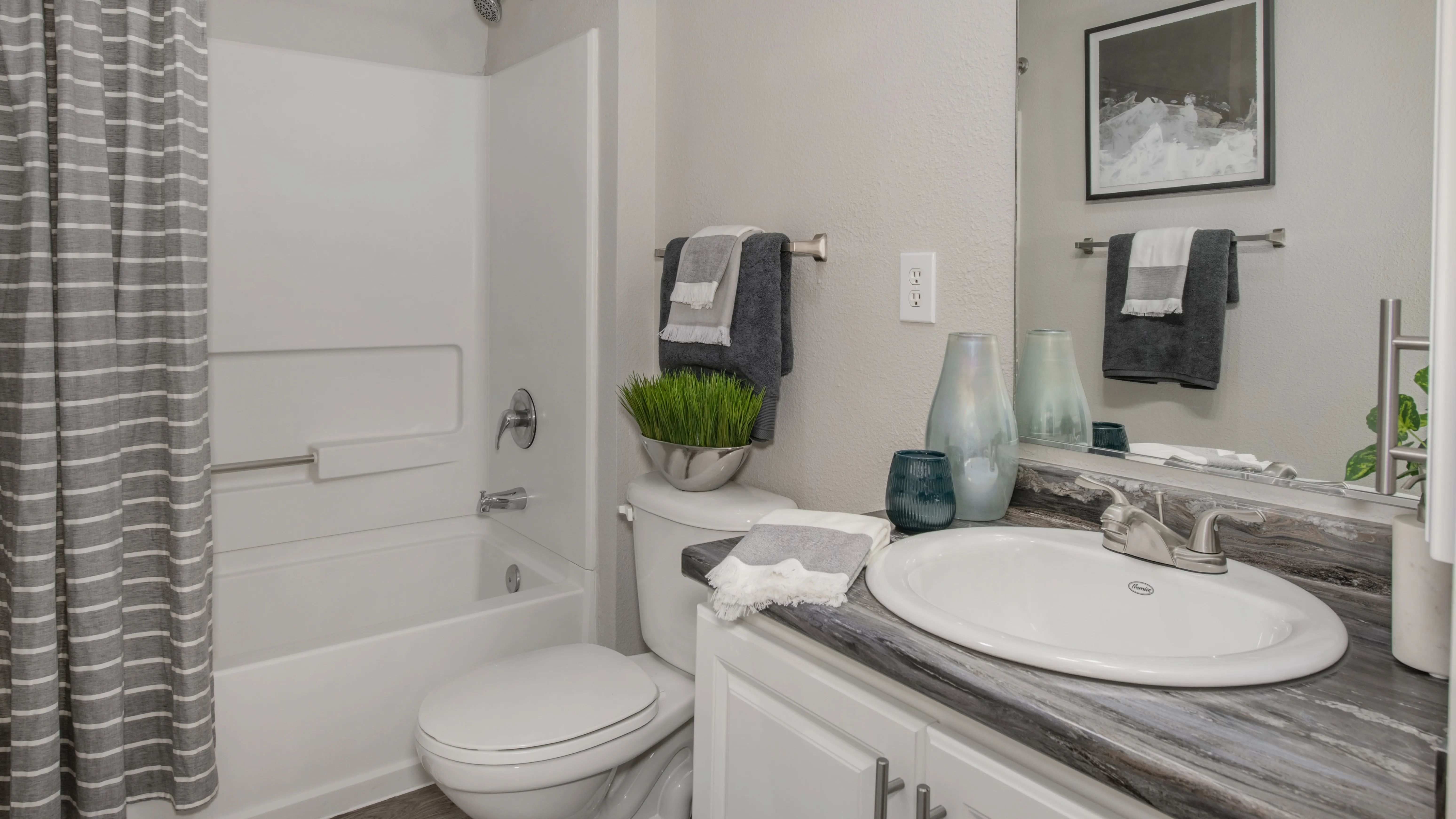 Luxuriate in spacious bathrooms designed for comfort, elegance, and modern living, featuring immaculate designs and ample vanity space. 