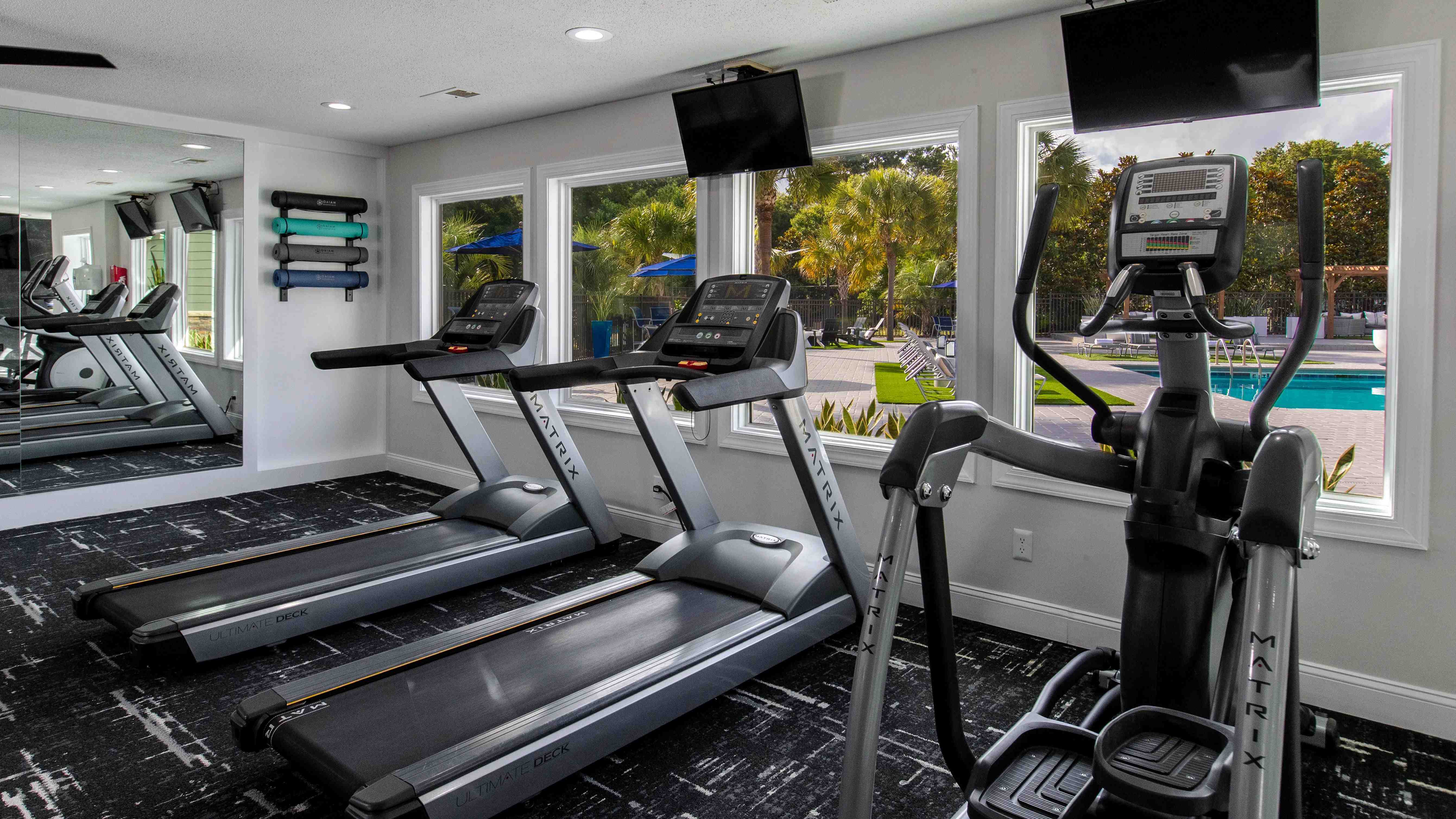 Our versatile cardio equipment features a view of our sparkling pool, offering a refreshing and inspiring workout experience.